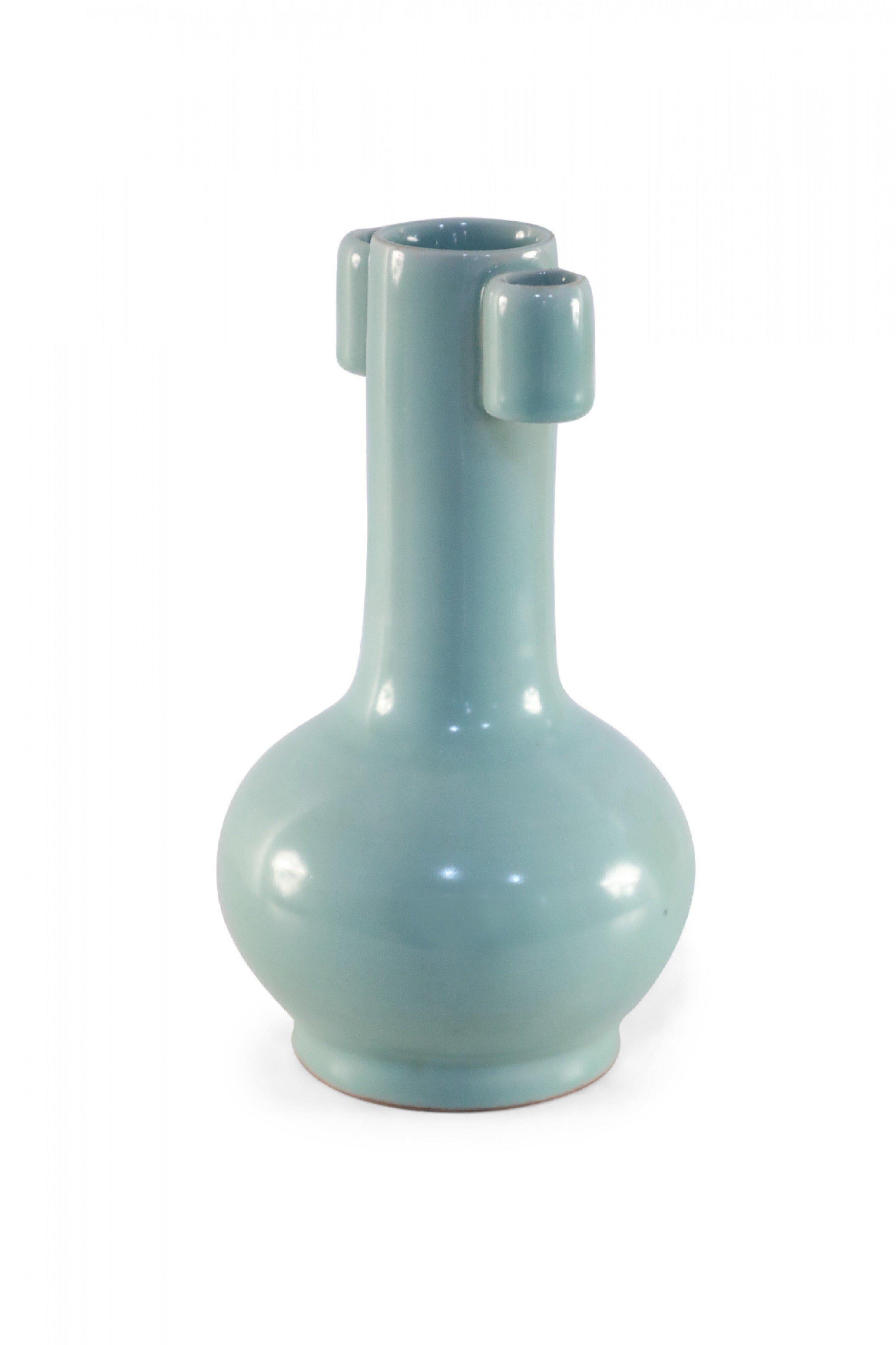 Antique Chinese (late 19th century) sky blue porcelain vase with a bulbous base and thin neck flanked by two lug ears at its top.
   