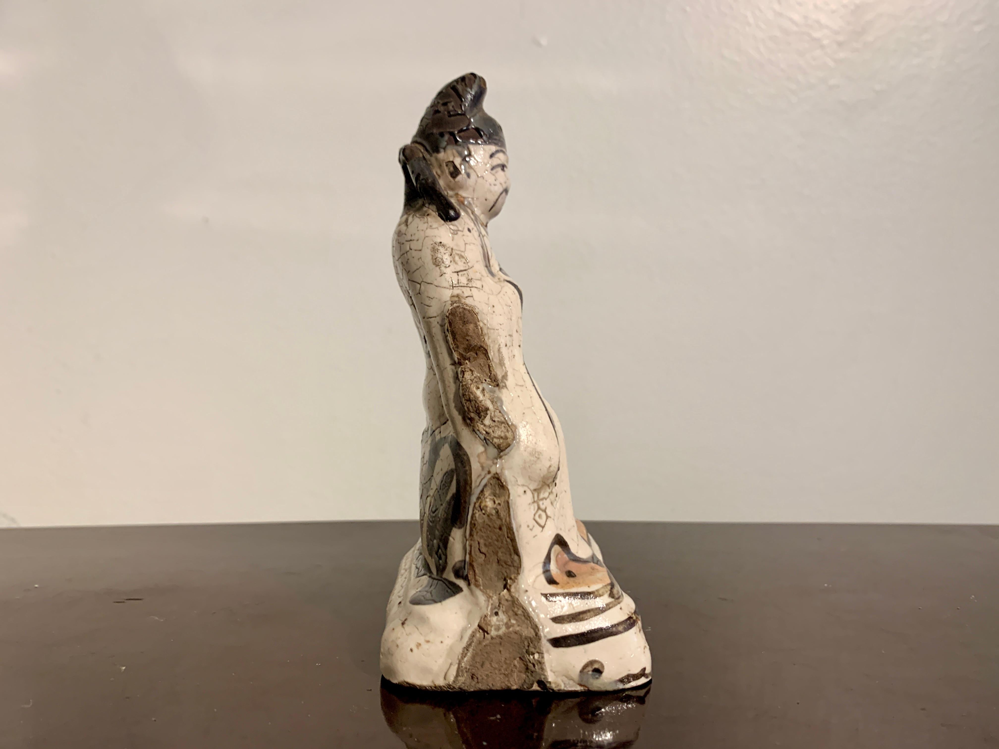 Fired Chinese Small Cizhou Glazed Figure of a Daoist Deity, Song to Ming Dynasty For Sale