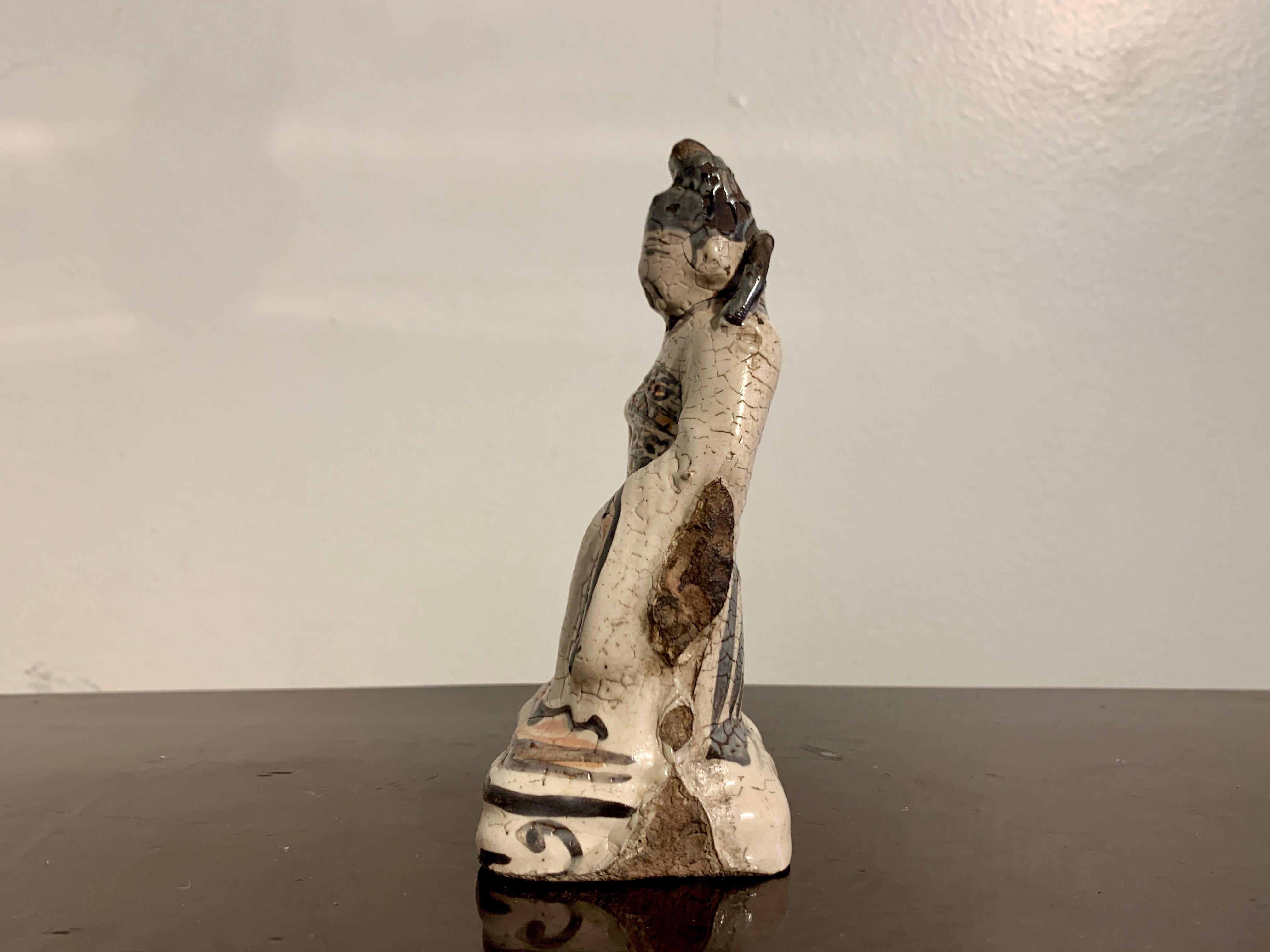 18th Century and Earlier Chinese Small Cizhou Glazed Figure of a Daoist Deity, Song to Ming Dynasty For Sale