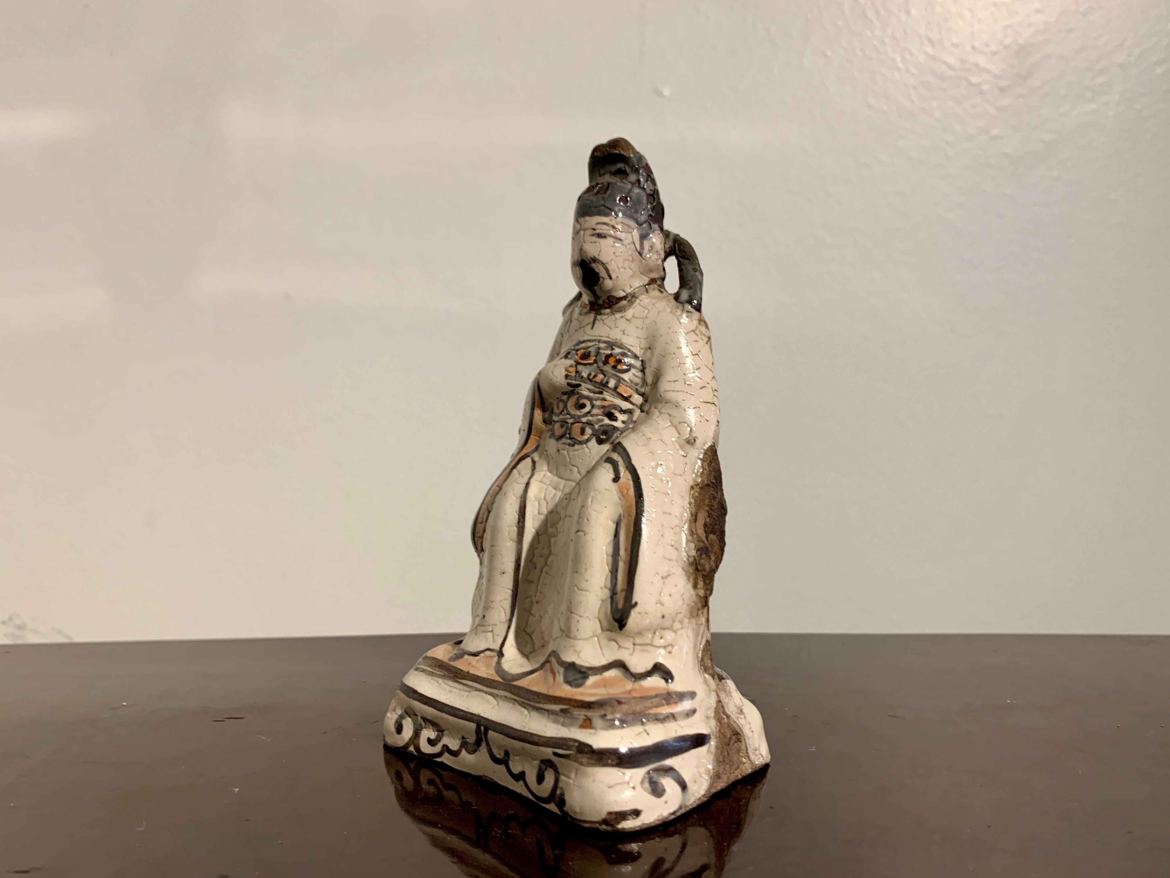 Stoneware Chinese Small Cizhou Glazed Figure of a Daoist Deity, Song to Ming Dynasty For Sale