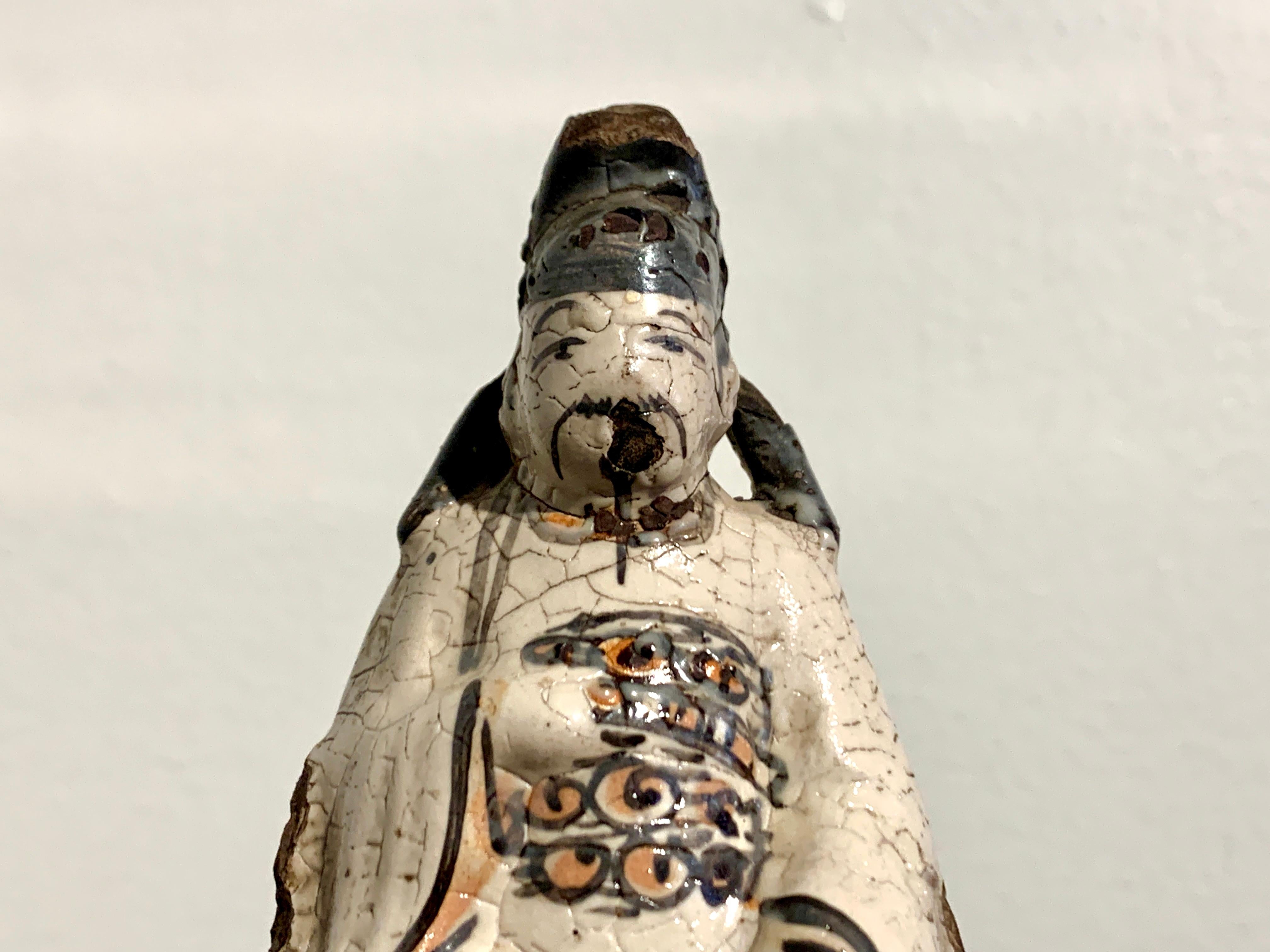 Chinese Small Cizhou Glazed Figure of a Daoist Deity, Song to Ming Dynasty For Sale 1