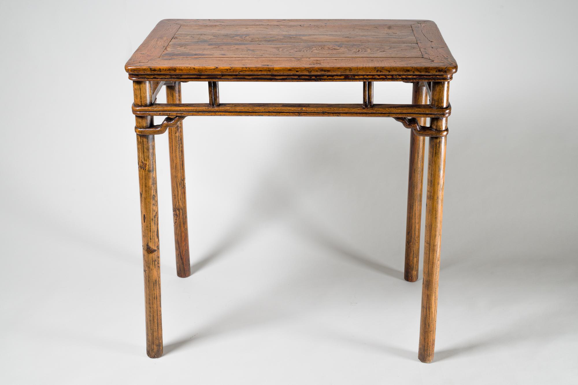 Originally used for writing, as made evident by the ink stains on top. Serpentine stretchers in each corner in the style of a 17th century table.