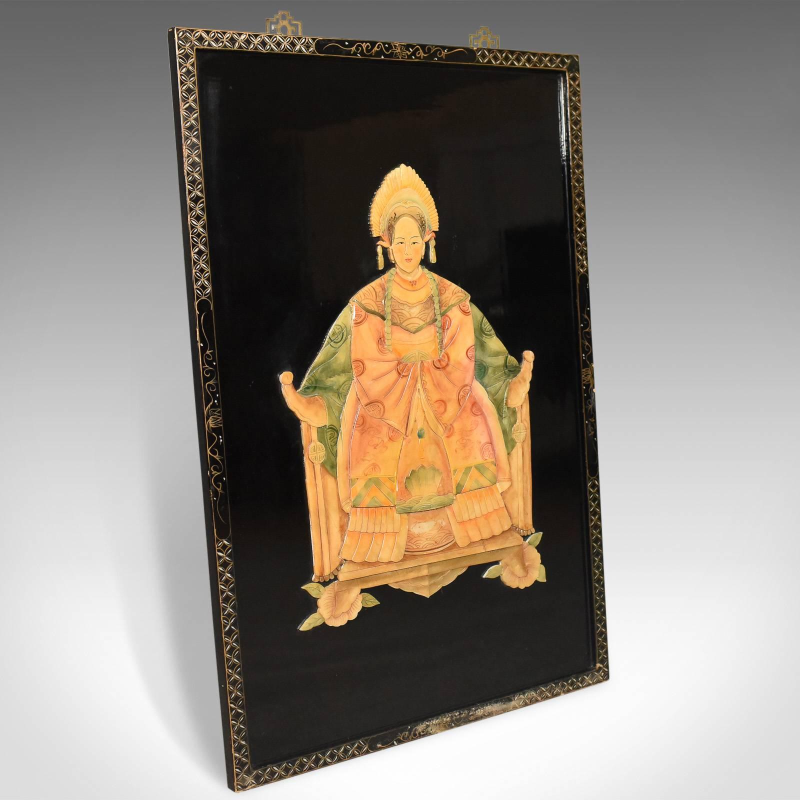 This is a Chinese painted soapstone overlay on lacquer, circa 1930s-1940s.

Top quality low relief stone work
Soft and subtle colors in earthy tones
In contrast to the black of the Japanned backdrop

Image of a figure, or deity, sitting
The