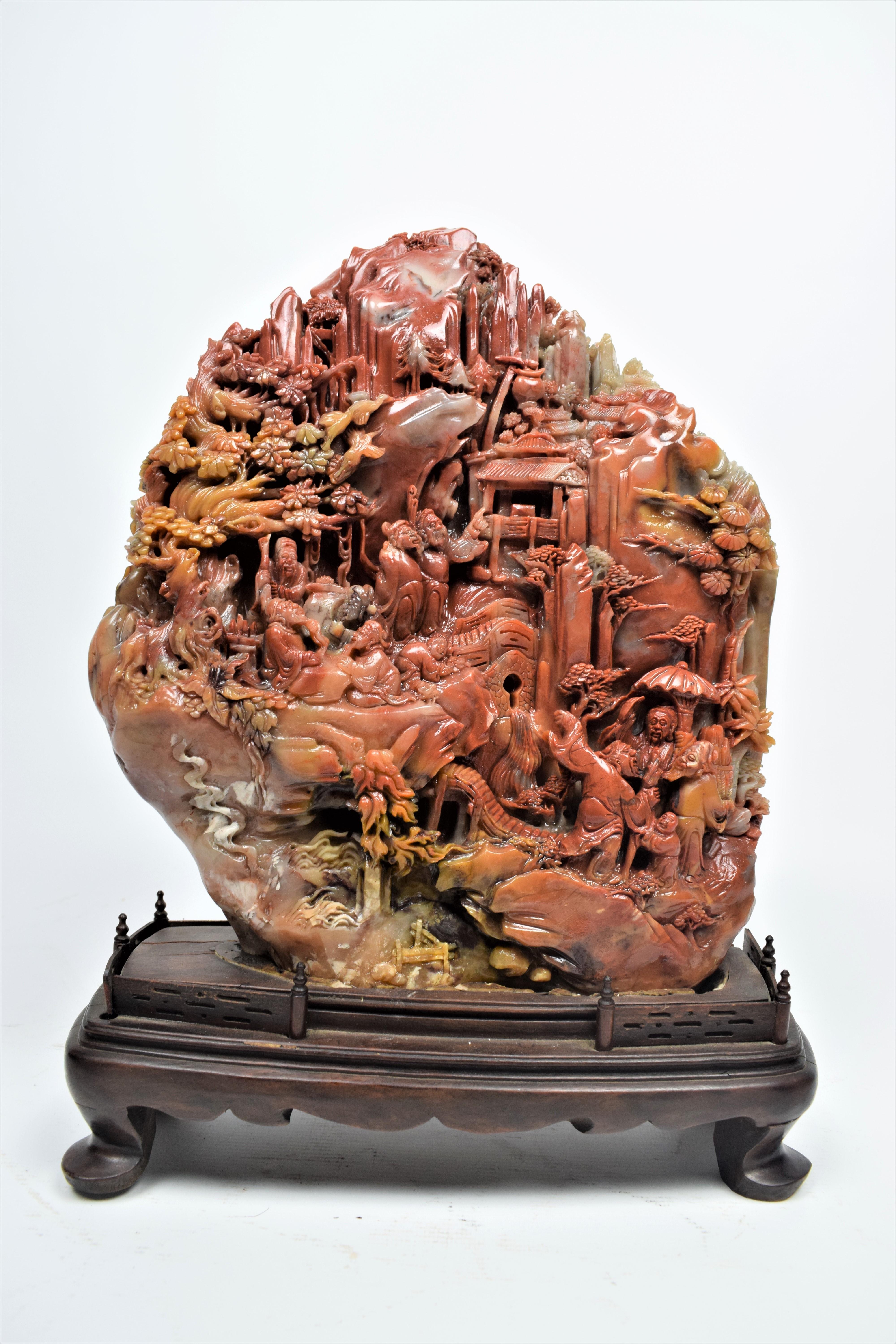 Chinese Soapstone Carving of a Buddhist Village Scene, Mid-20th century.
Shoushan stone carving is an art originating in Fujian Province in Eastern China. Use of the stone for carving can be traced back as far as the Southern Dynasties and has long