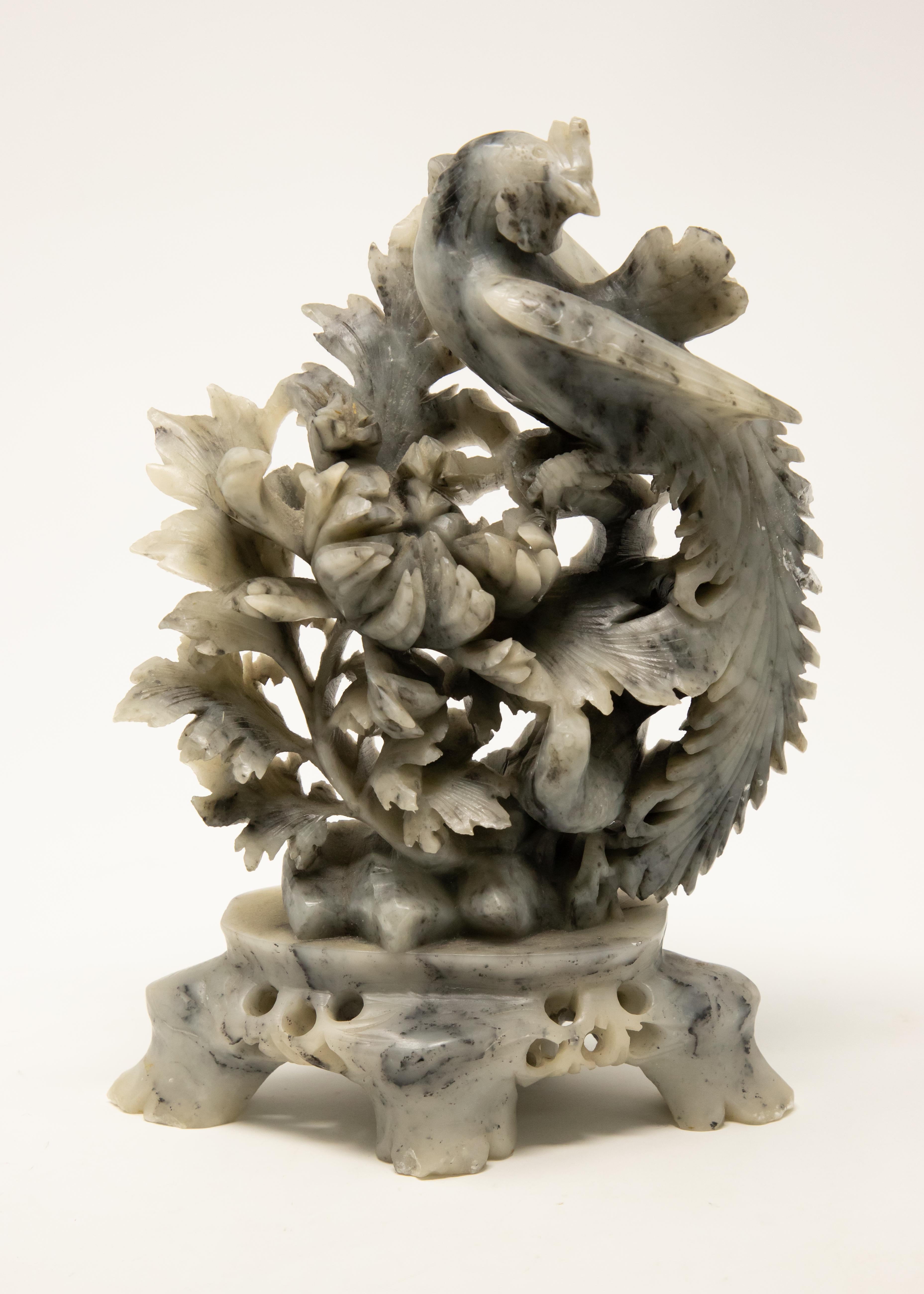 Offering this stunning hand carved soapstone featuring a phoenix. Starting on the base with four legs on an oblong base. Beautiful openwork carving leads up to the main body of the piece. The gorgeous foliate and floral carving dazzle the eye. To