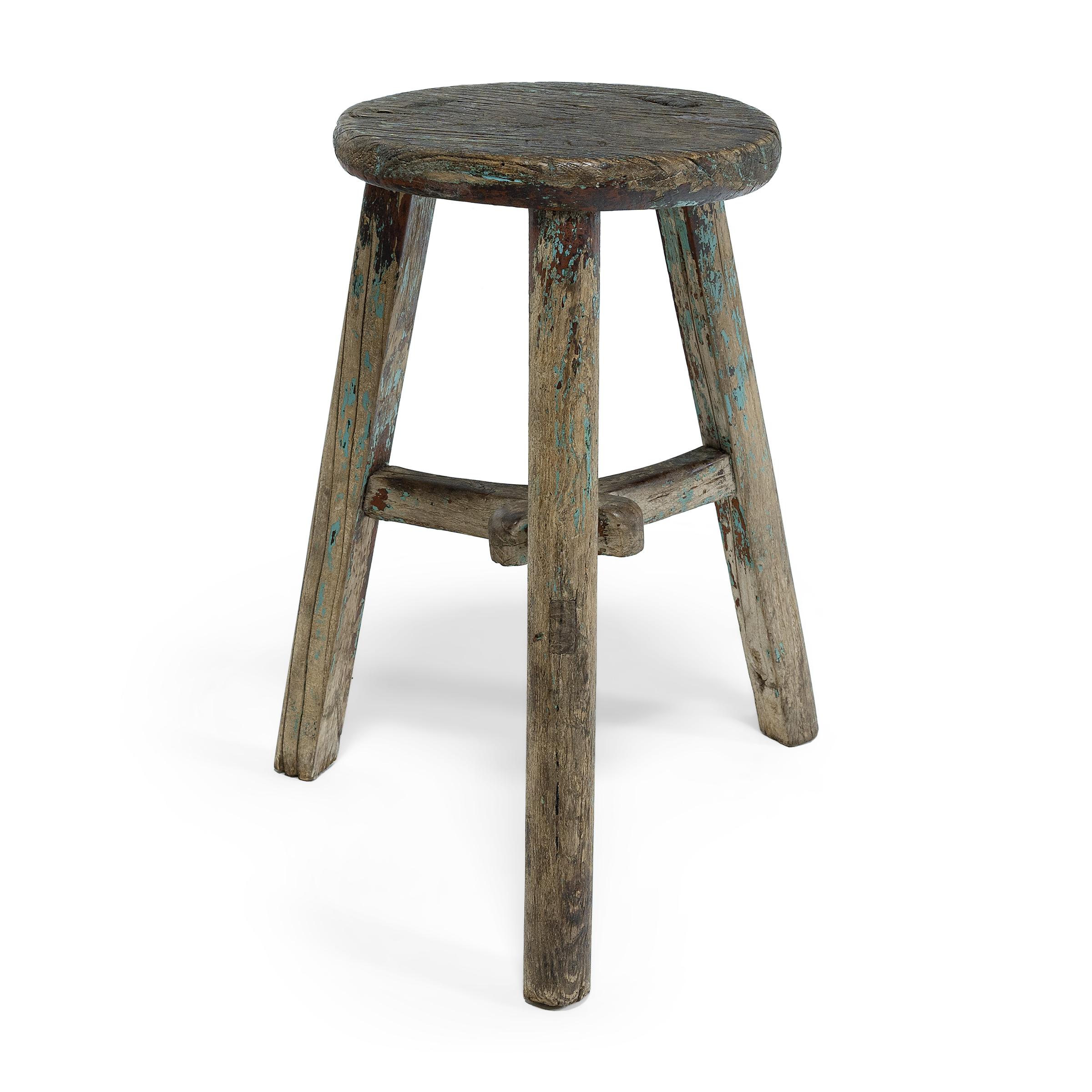 This rustic stool from Shanxi province charms with its simple form and fantastic texture. The wooden stool embraces the notion of 