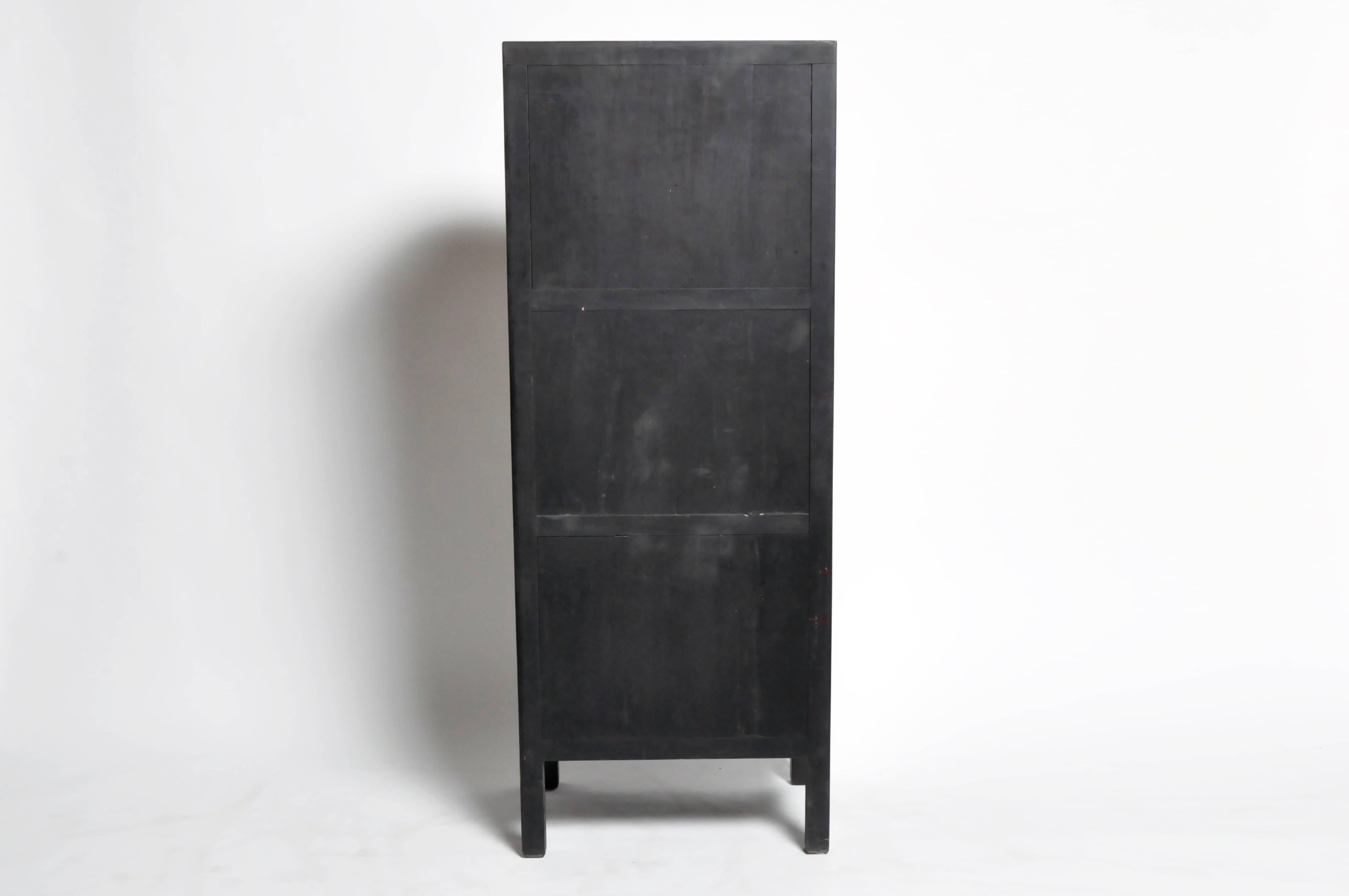 This handsome spindle cabinet is from Ningbo, China and was made from cypress wood. The piece features mortise and tenon joinery and two shelves for storage. You can also customize a new one and make it your own. Wood, color, finish, and dimensions