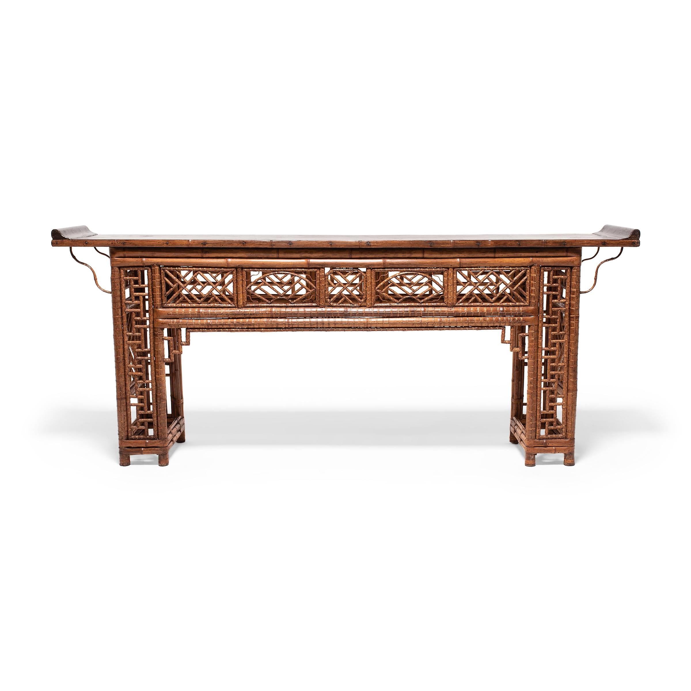 The artisan who created this exquisite lattice altar table must have truly been a master of their craft. Constructed of carefully bent spotted bamboo, the table has a straight, open frame patterned with intricate bamboo latticework. Every available
