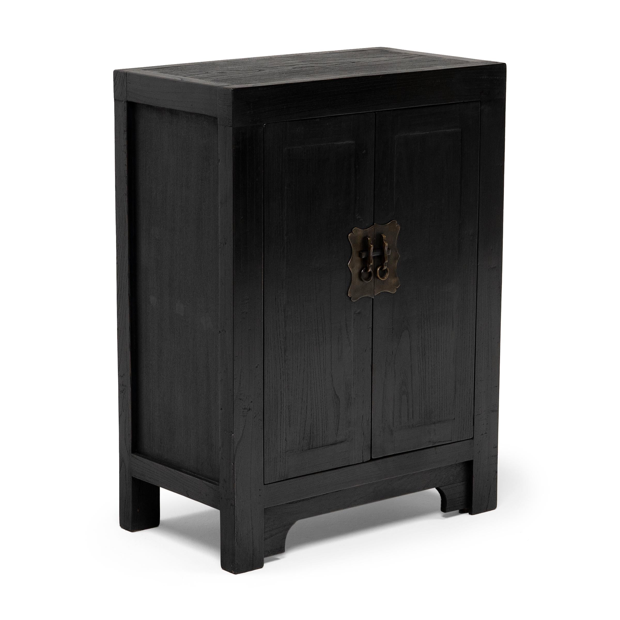 Perfecting line and proportion, the simple design of this low locking chest celebrates the restraint of classic Chinese furniture forms. Crafted from reclaimed elmwood, the cabinet is modeled after those used for general storage in a Qing-dynasty