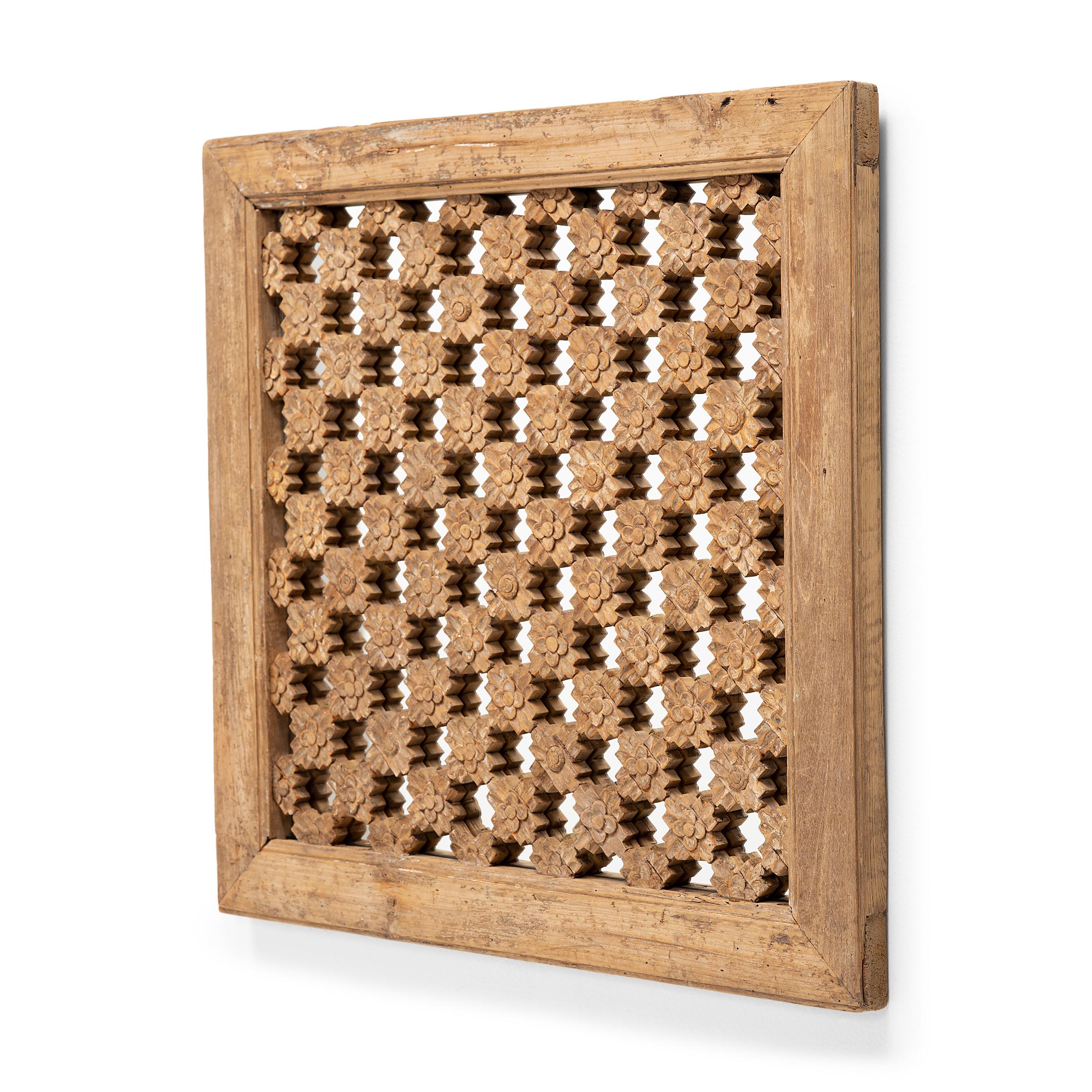 This early 20th century lattice window panel likely originated in a northern Chinese home with neutral and balanced interiors. Both functional and decorative, lattice windows allowed for fresh air and light to flow into a room while still