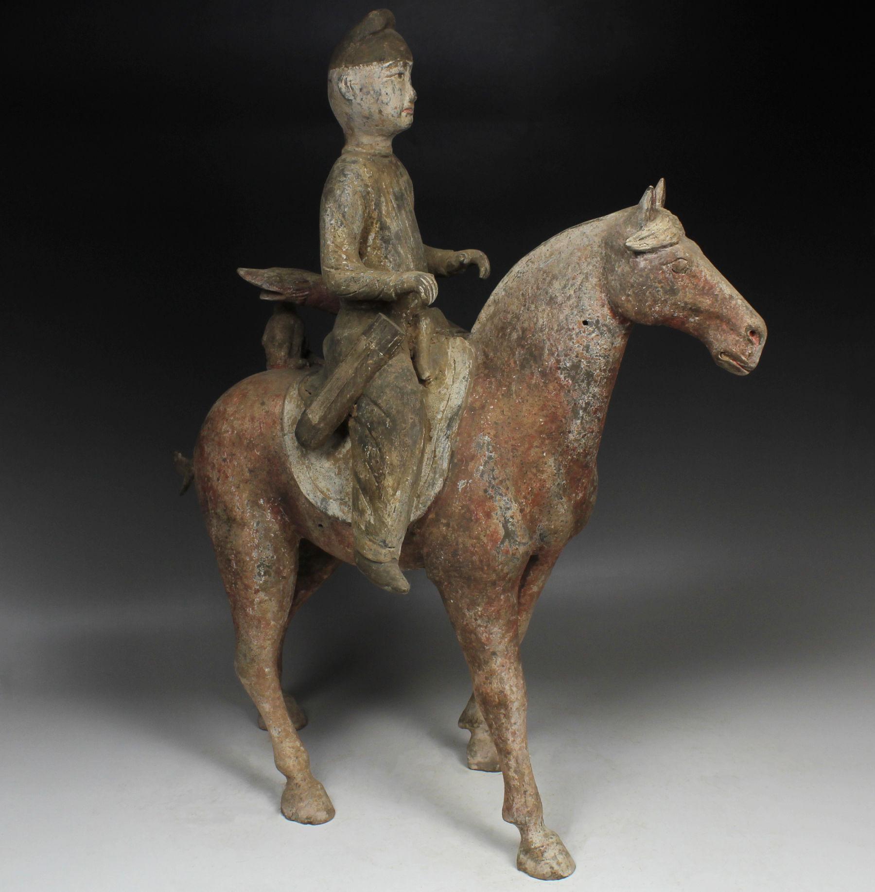 Pottery Chinese statuette of a horse with rider For Sale