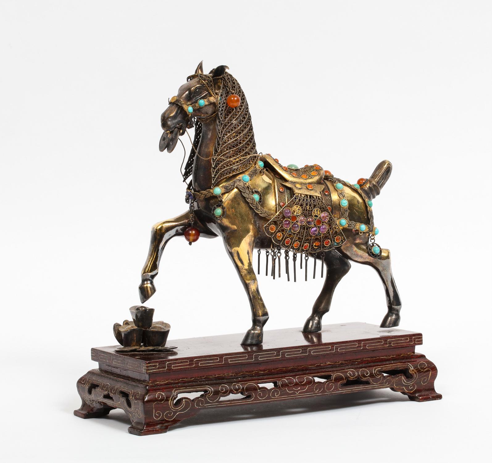 Chinese sterling silver horse with applied jewels and turquoise on wood stand,
20th century.

Marked Silver and 925.

Measures: 8.25