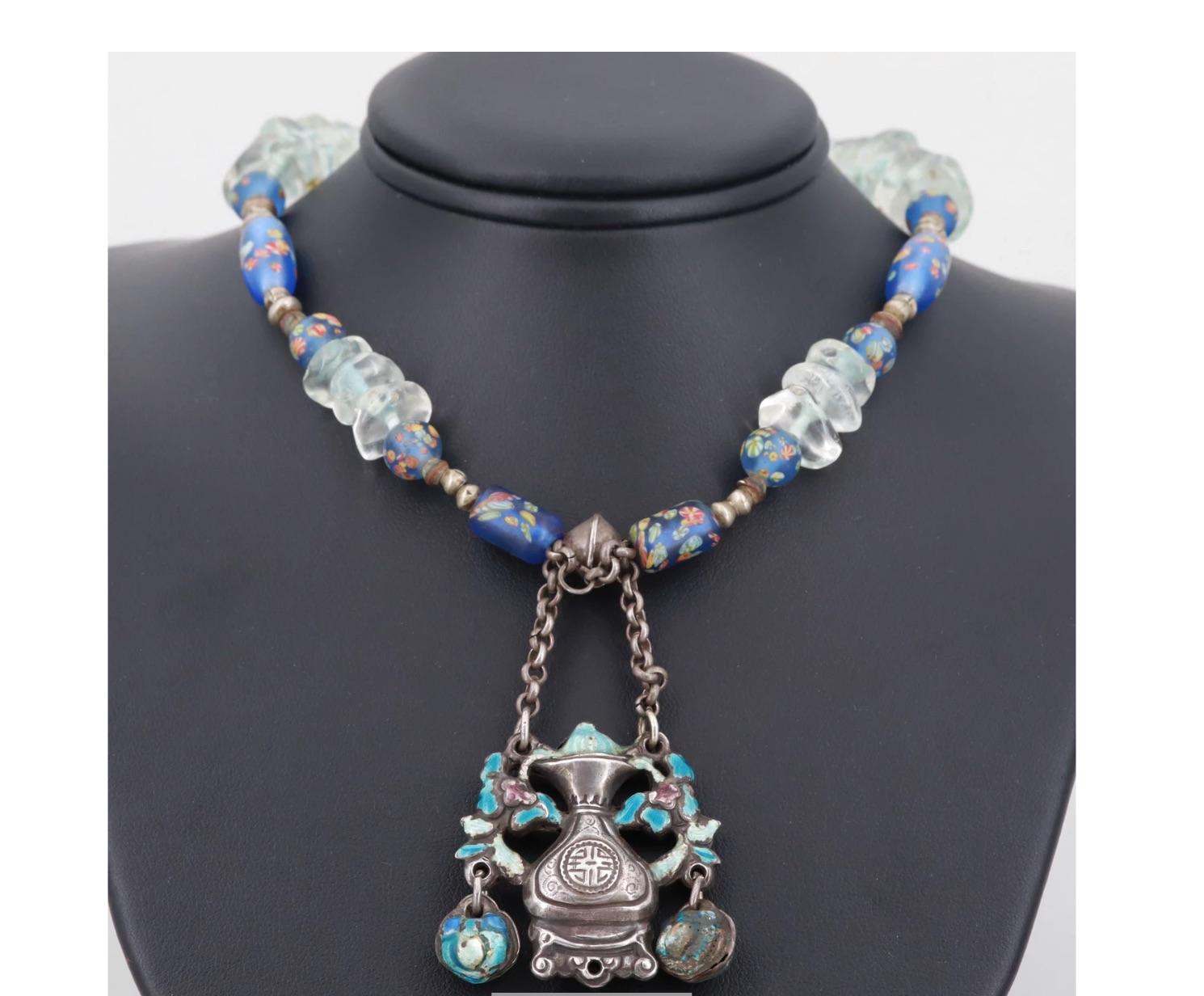 A most unusual rare Inspired vintage early 20th century or before, Asian Silver Pendant Necklace. It is a statement necklace, head turner!

Incredibly Beautiful Fashionable Necklace with Rock Crystal Quartz Beads, Enameled Glass Beads, silver beads,