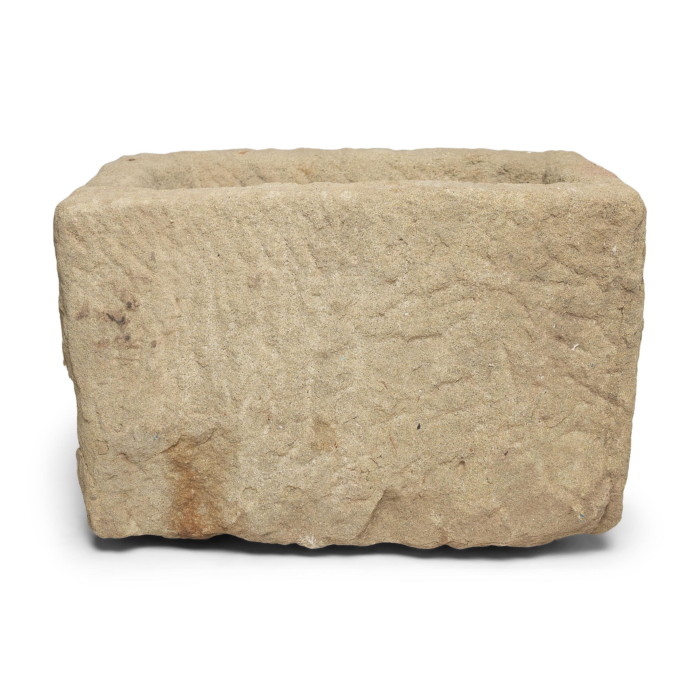 Once used on a Provincial Chinese farm to hold water or animal feed, this early 20th century stone trough is celebrated today for its organic form and rustic authenticity. hand carved from solid limestone, the trough has a rectangular form with