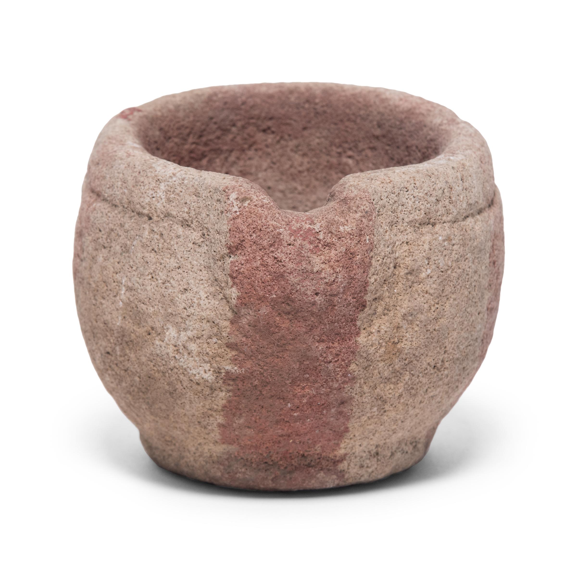 Hand carved from a single block of limestone, this round stone vessel is an early 20th century mortar once used daily in a Provincial kitchen to grind herbs, spices, and other foods. Used as a decorative vessel or tabletop planter, the mortar's
