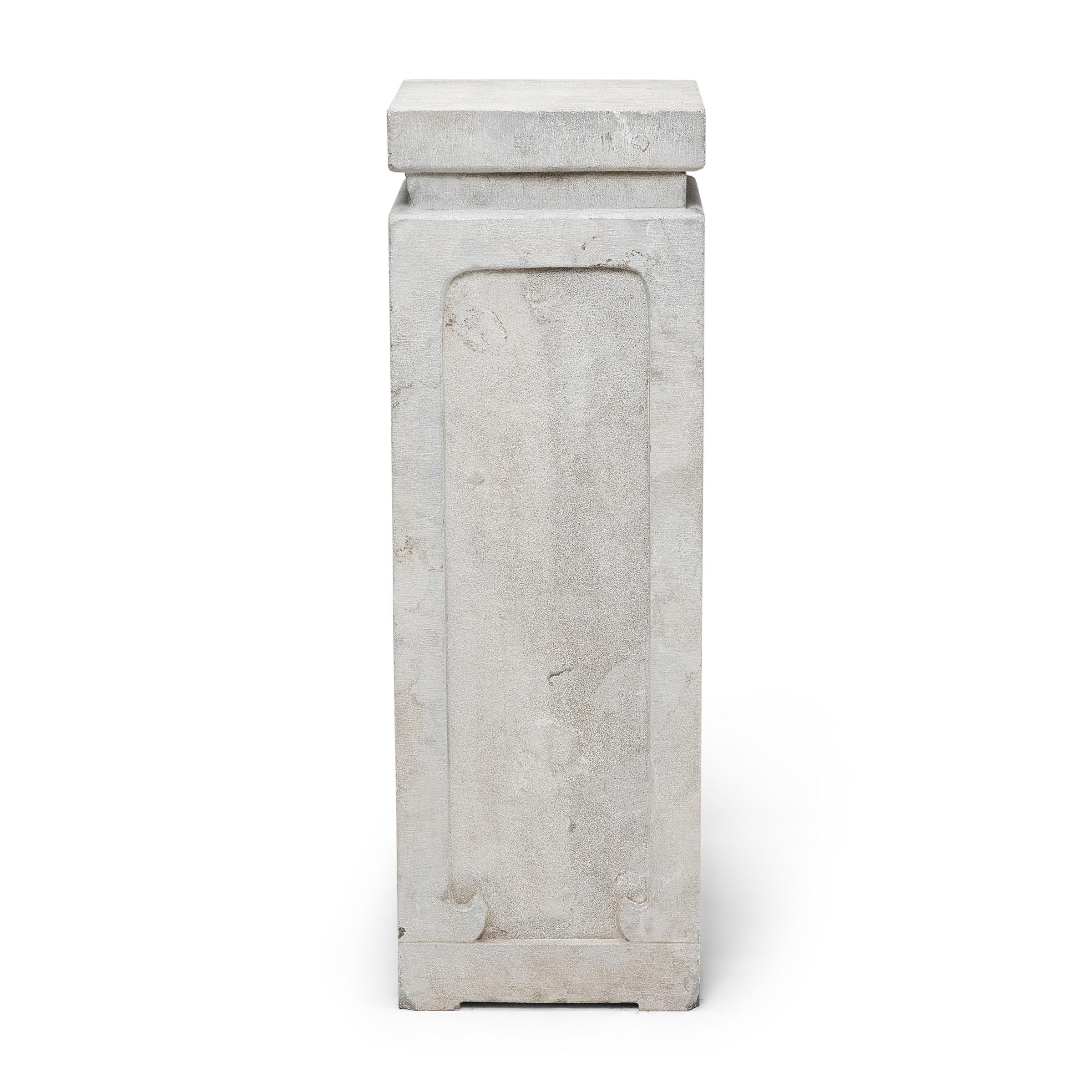 This minimalist stone pedestal exemplifies the quiet refinement and simplicity that defined Ming-dynasty stone furniture. Hand-carved of solid limestone by artisans in Shanxi province, the pedestal resembles a high tea table or incense stand,