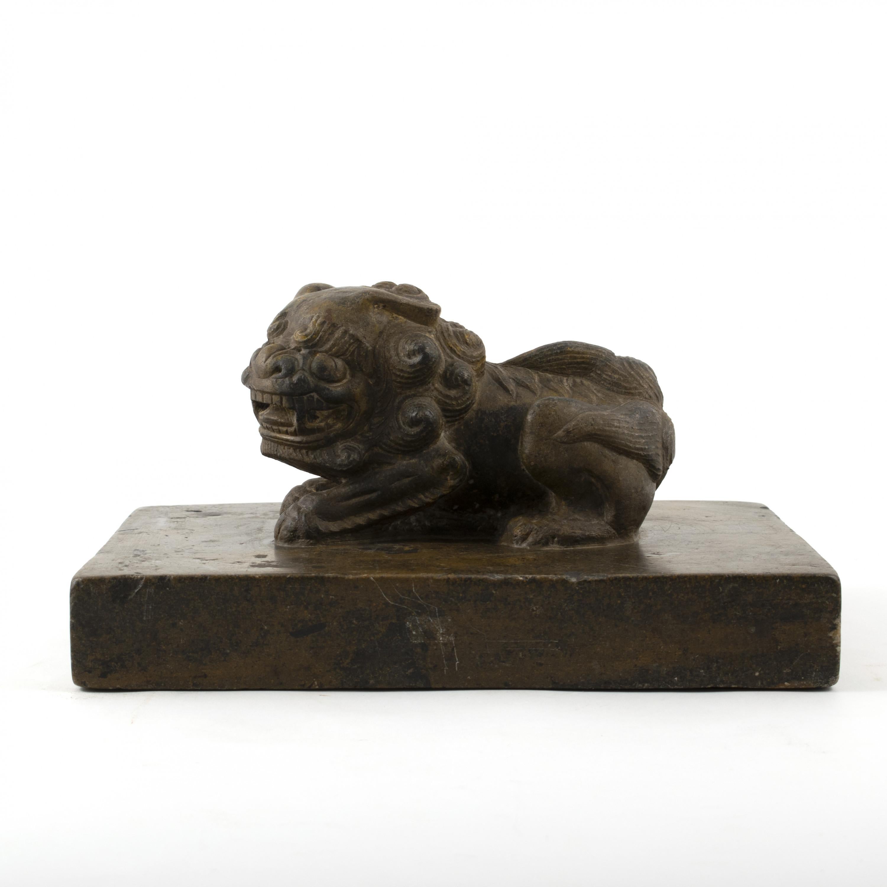 18th-19th century Chinese carved stone sculpture depicting a Foo Dog.
Carved from a solid piece of stone, this weight was originally used by a Shoemaker. After layers of fabrics are Binder and glued, weights like these were put on top to make the