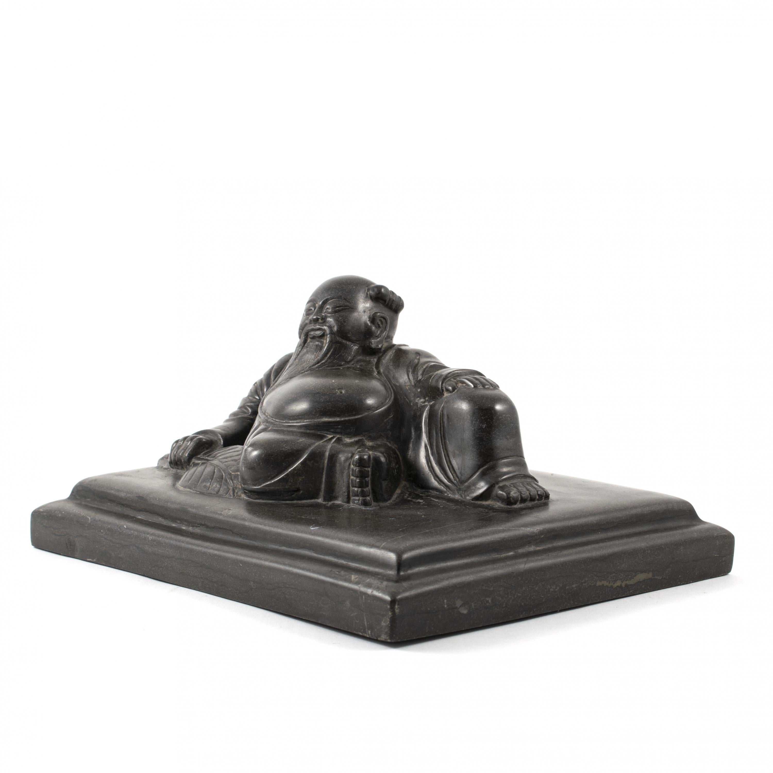 18th-19th century Chinese carved stone sculpture depicting a Happy Buddha.
Carved from a solid piece of black stone, this weight was originally used by a Shoemaker. After layers of fabrics are binder and glued, weights like these were put on top to