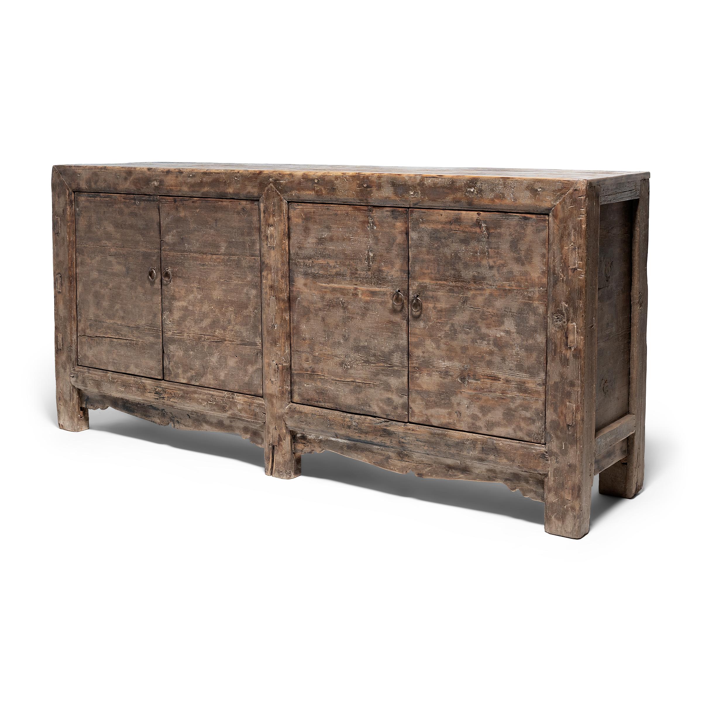 Created in the style of Mongolian storage coffers, this late 19th-century herdsman's chest has a minimalist design and plenty of rustic appeal. Originally configured to open from the top, this chest was modified with front-facing doors by our