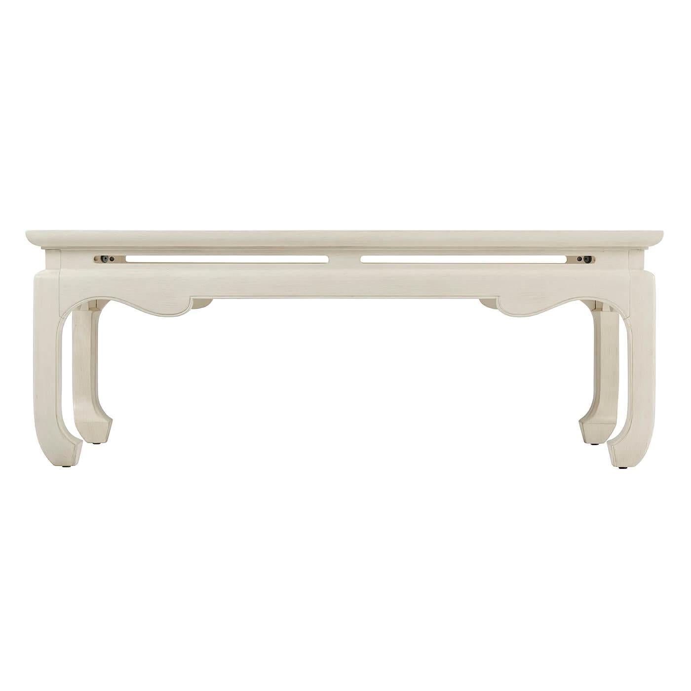 Chinese style cocktail table, a fresh modern update on a classic Chinoiserie silhouette. The rectangular tabletop with a beautiful pierced and wavy apron is set on inswept legs.
Shown in Salted White Finish
Dimensions: 48