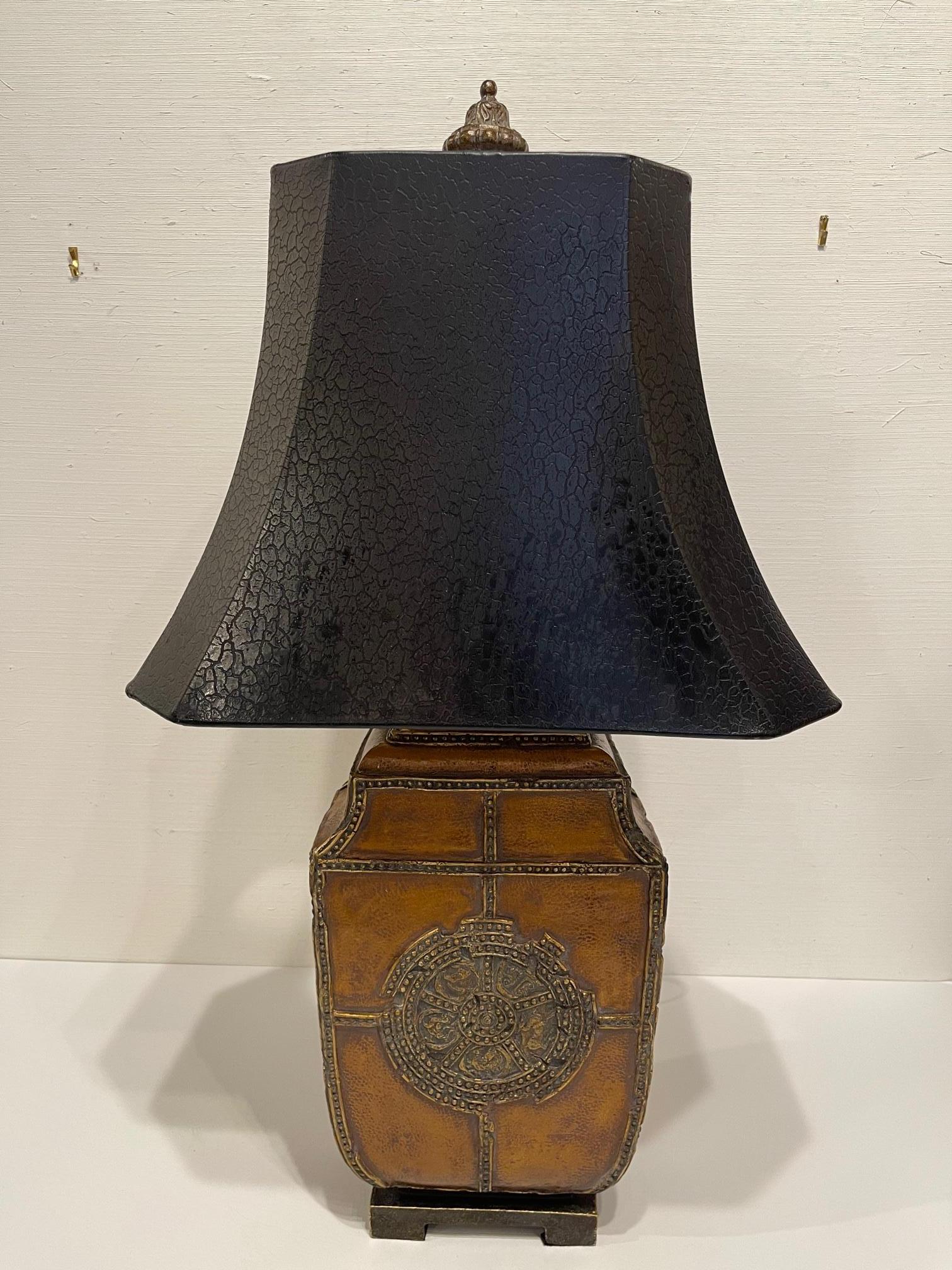 Chinese style leather lamp with a black shade, 20th century.