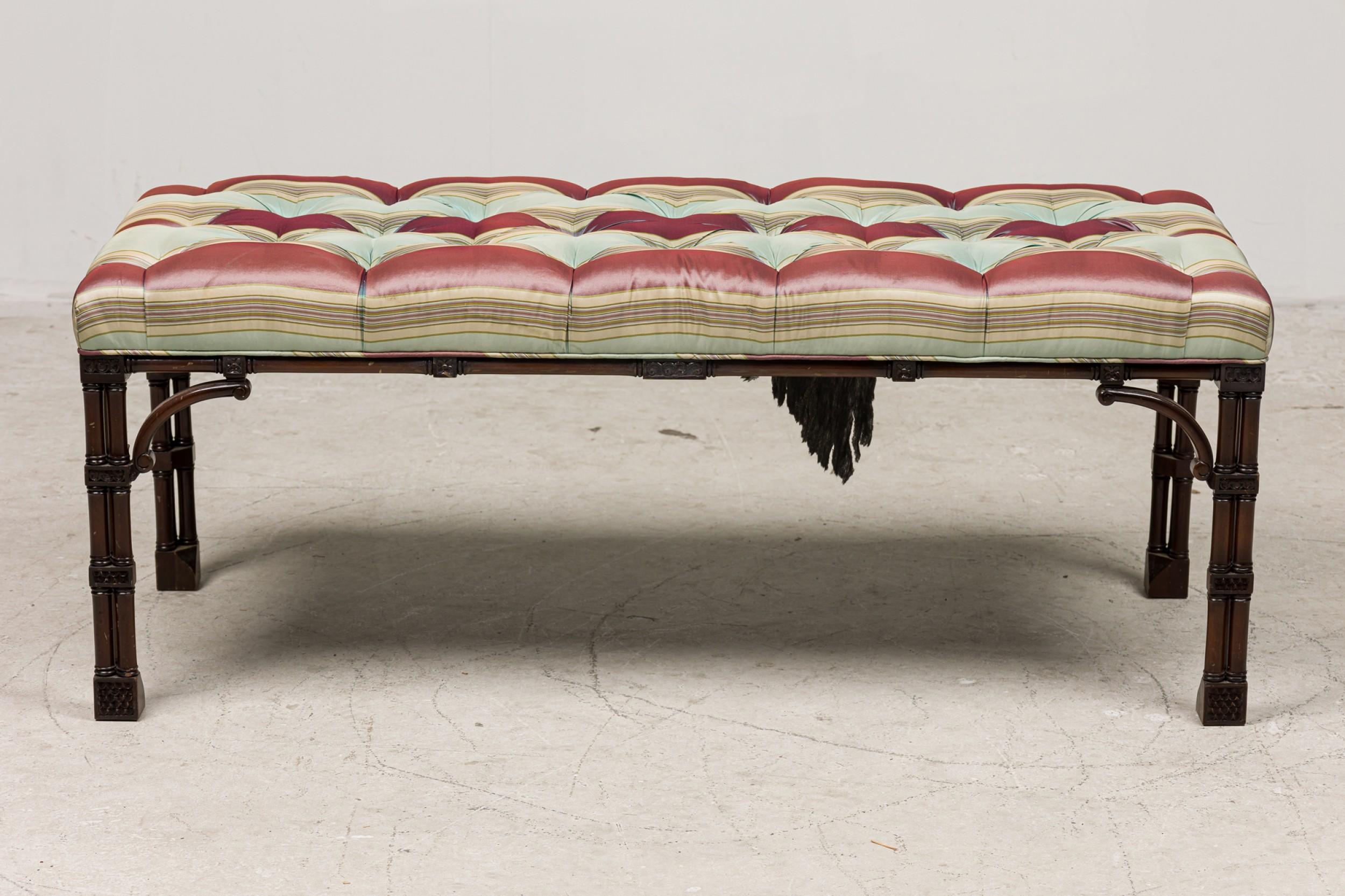 English Chinese Chippendale style (20th Century) mahogany rectangular bench with a tufted striped upholstered seat and having a faux bamboo frame with cluster legs