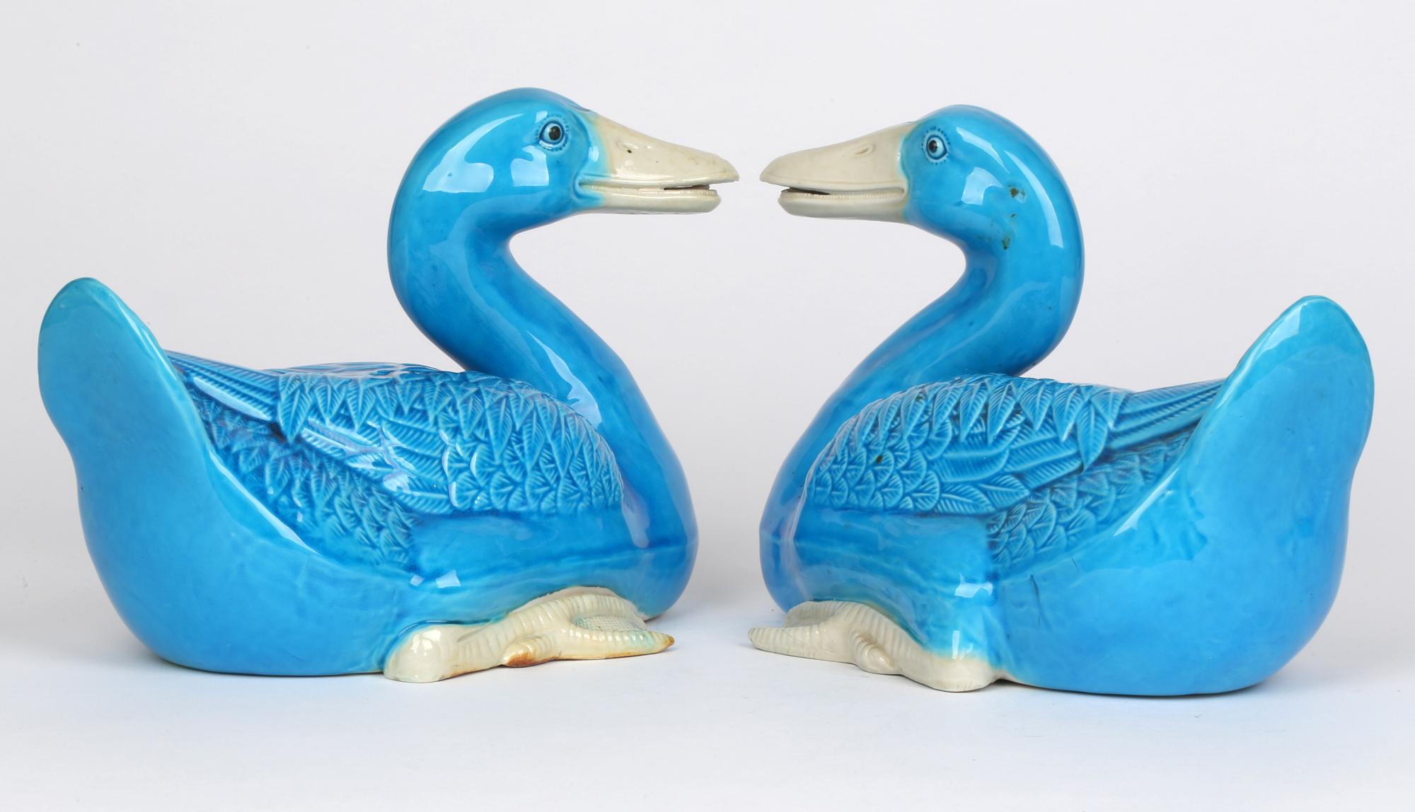 A very stylish and finely made Chinese pair porcelain turquoise glazed duck figures dating from the early to mid 20th century. The ducks are portrayed in a resting or swimming position with their heads held up and their feet gathered in at their
