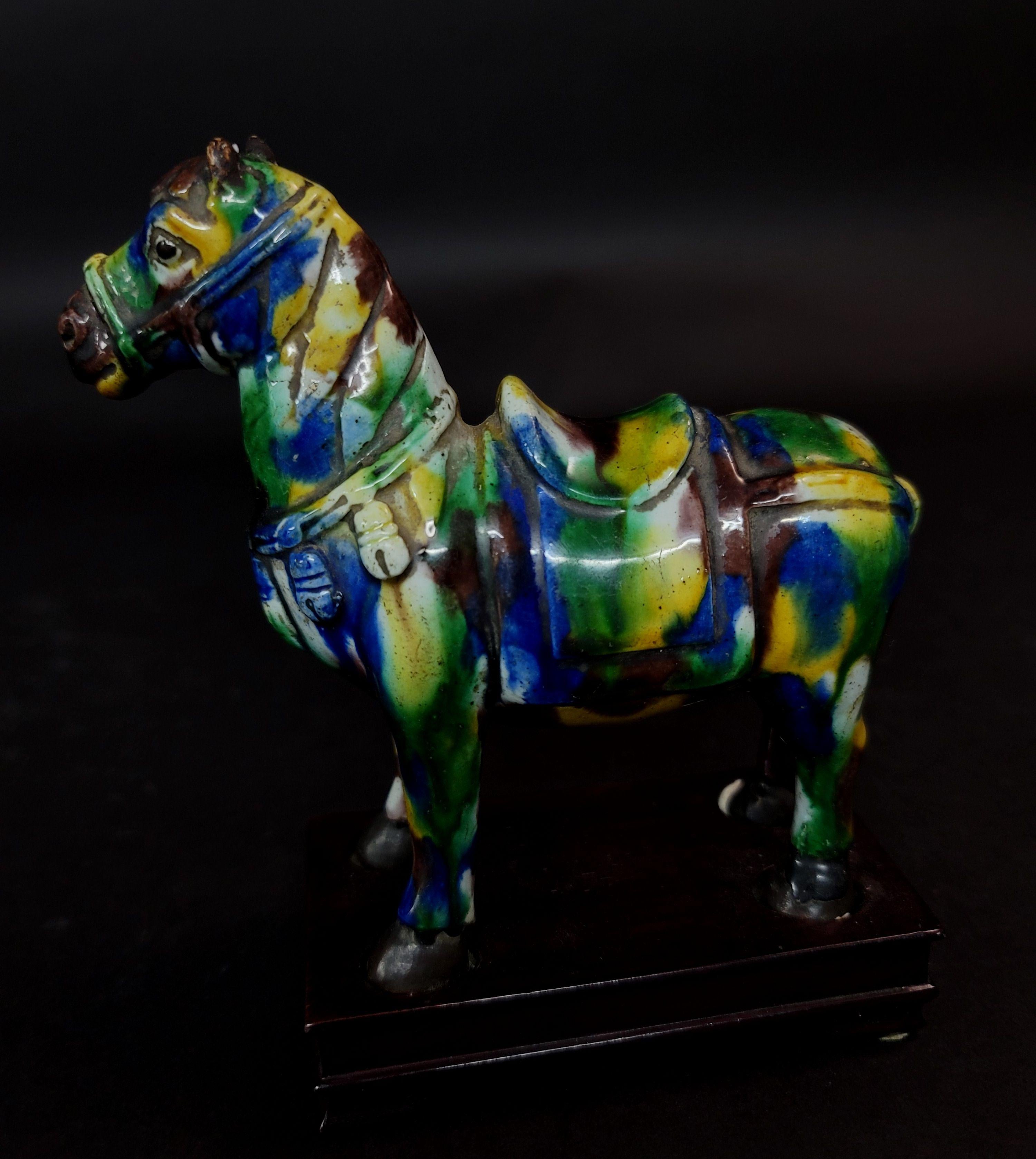 Chinese Su Sanci glazed figure of a horse and a boy. Sancai decoration uses glazes predominantly in three colors: brown or amber, green or creamy white with the more rare use of blue. While particularly associated with the Tang dynasty tomb figures,