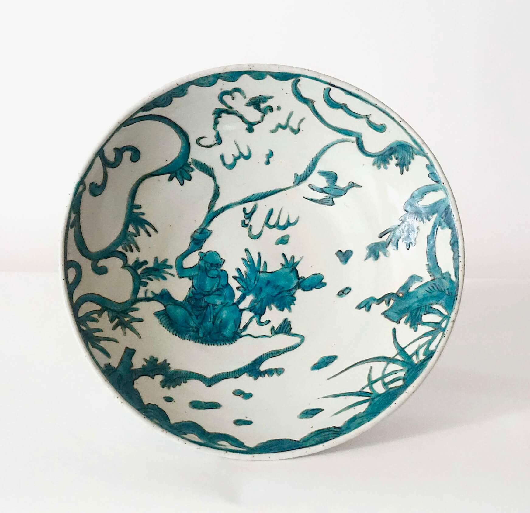 An exceptional and exceptionally rare, pristine, circa 1600 Chinese Ming Dynasty, Wanli reign, export for the Japanese market 'Swatow' or 'Zhangzhou' shallow bowl of Jingdezhen manufacture, the round form having unusual scene of a robed monkey as a