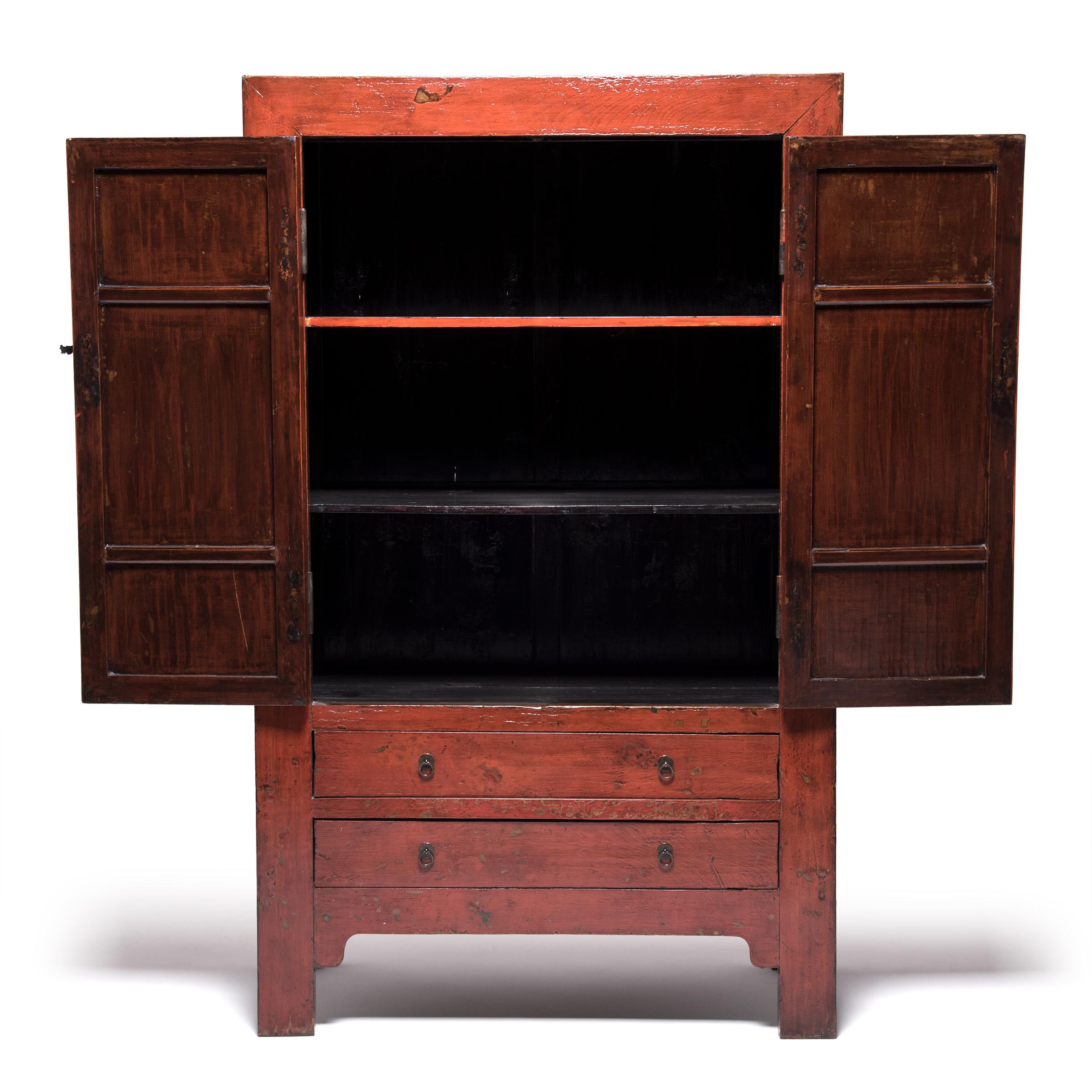 Made in northern China during the mid-19th century, this tall cabinet was likely part of wedding dowry, bestowed upon a groom filled with silks and gifts. Constructed with mortise and Tenon joinery, the Elmwood square-corner cabinet embodies the