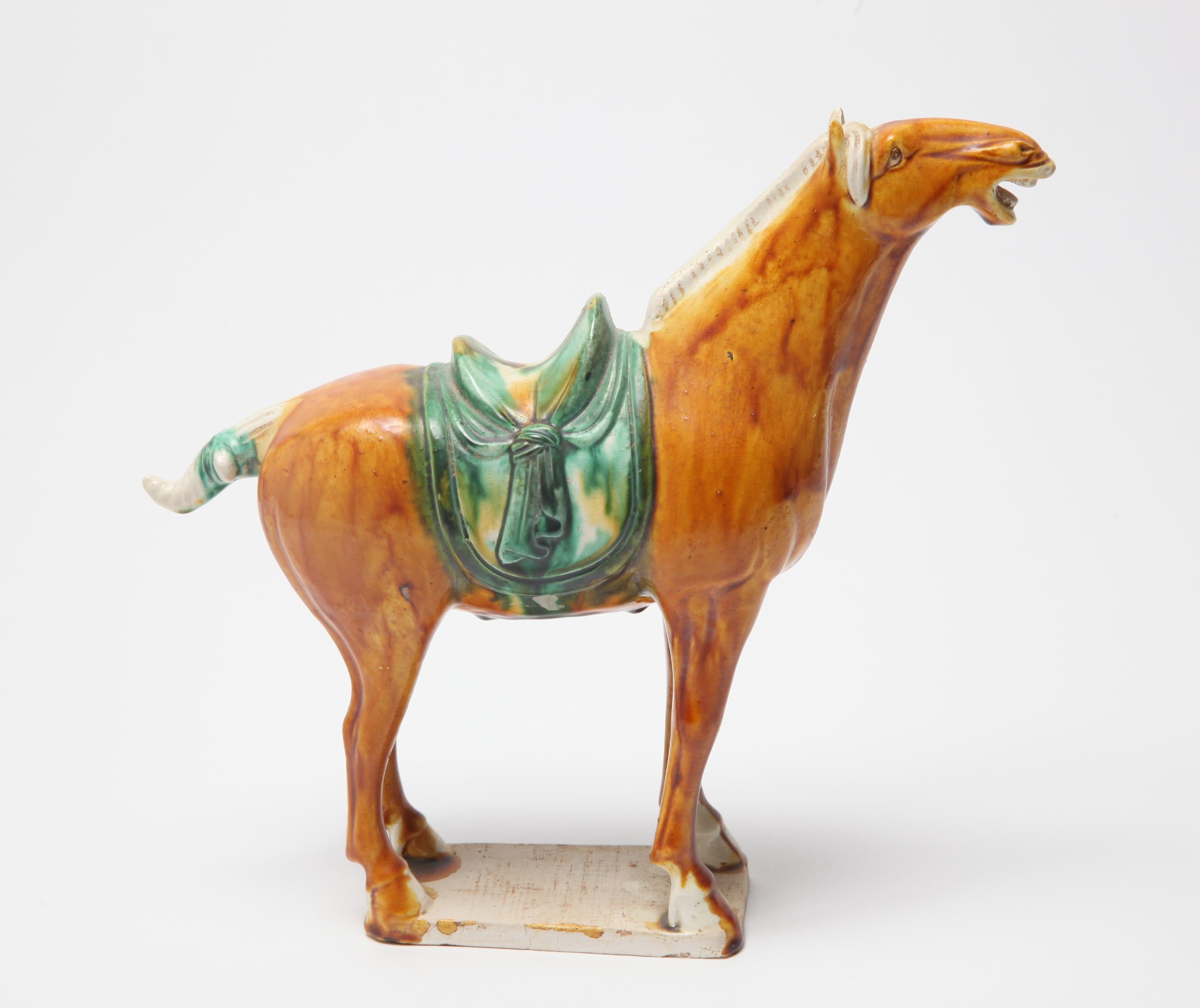 Chinese Tang dynasty style sancai glazed ceramic horse sculpture. The piece is in great vintage condition with age-appropriate wear and use.