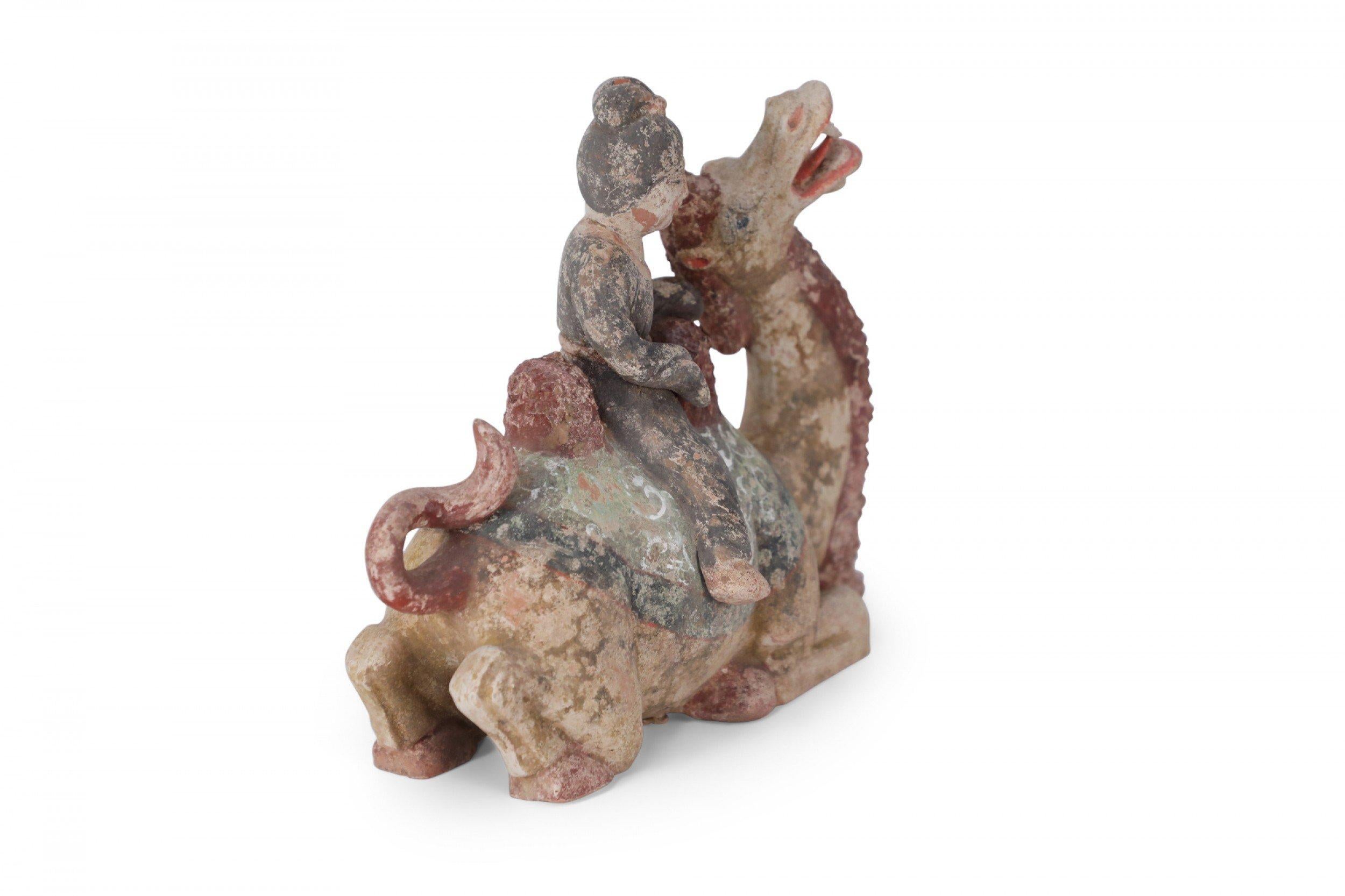 Chinese Tang Dynasty-Style Terra Cotta Woman and Kneeling Camel Tomb Figure For Sale 1