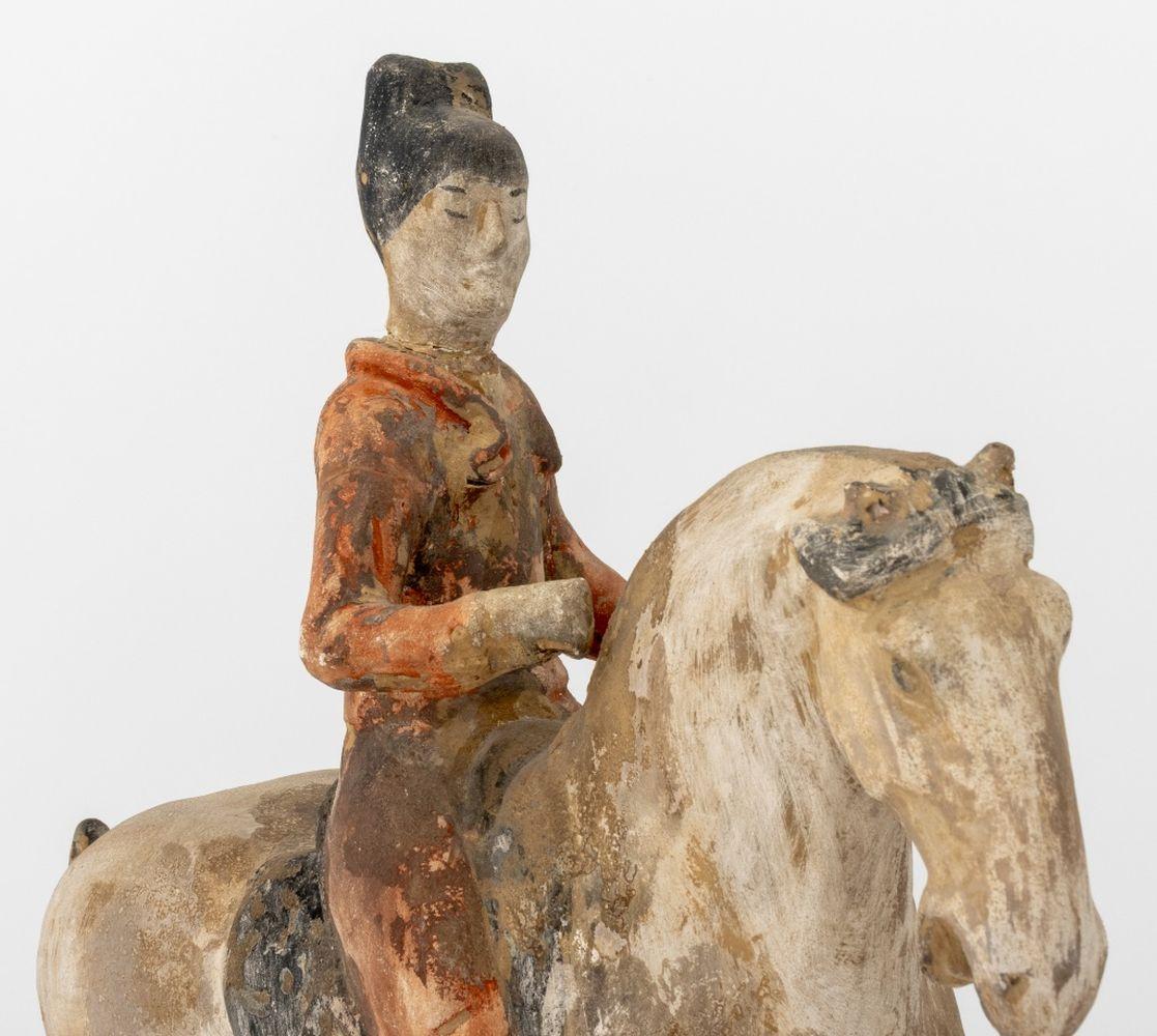 Chinese Tang Dynasty Horse and Rider Pottery Sculpture, with hand-painted details atop a rectangular base. 16