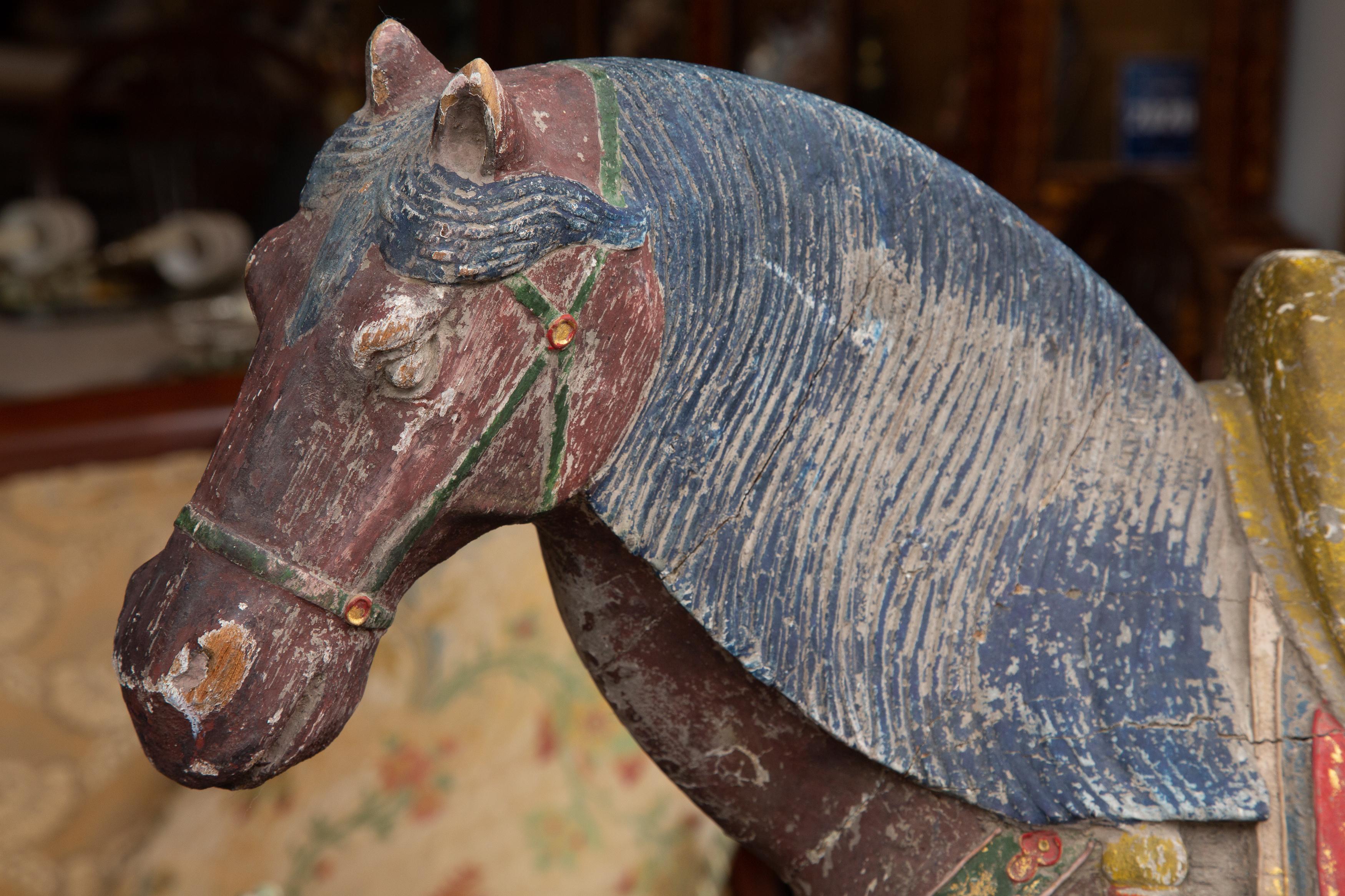 This is a very collectible carved and polychromed Chinese Tang style wood horse, stately and decorative.