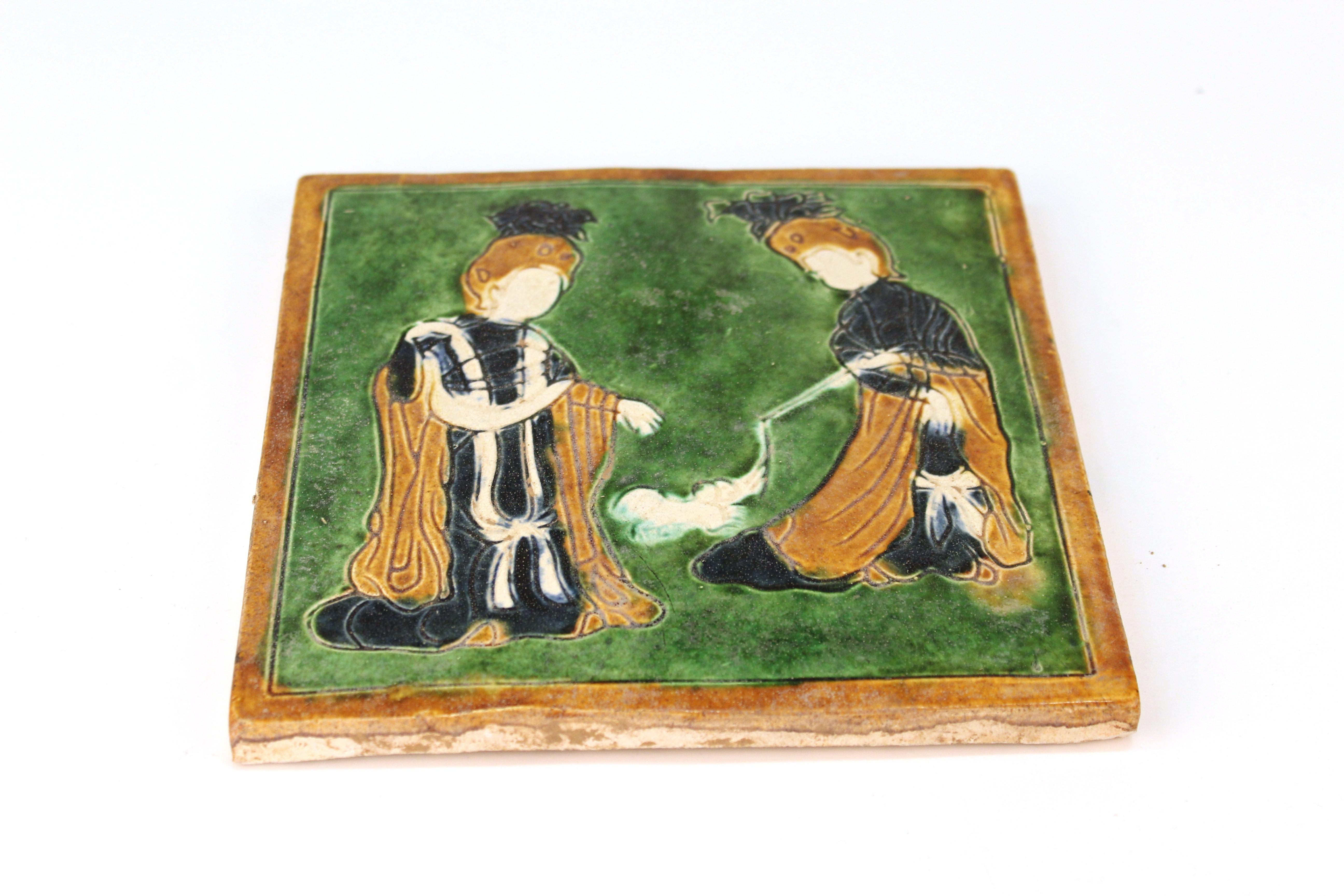 Chinese Tang Style Sancai-Glazed Flat Tile Depicting Women Playing with a Dog 1