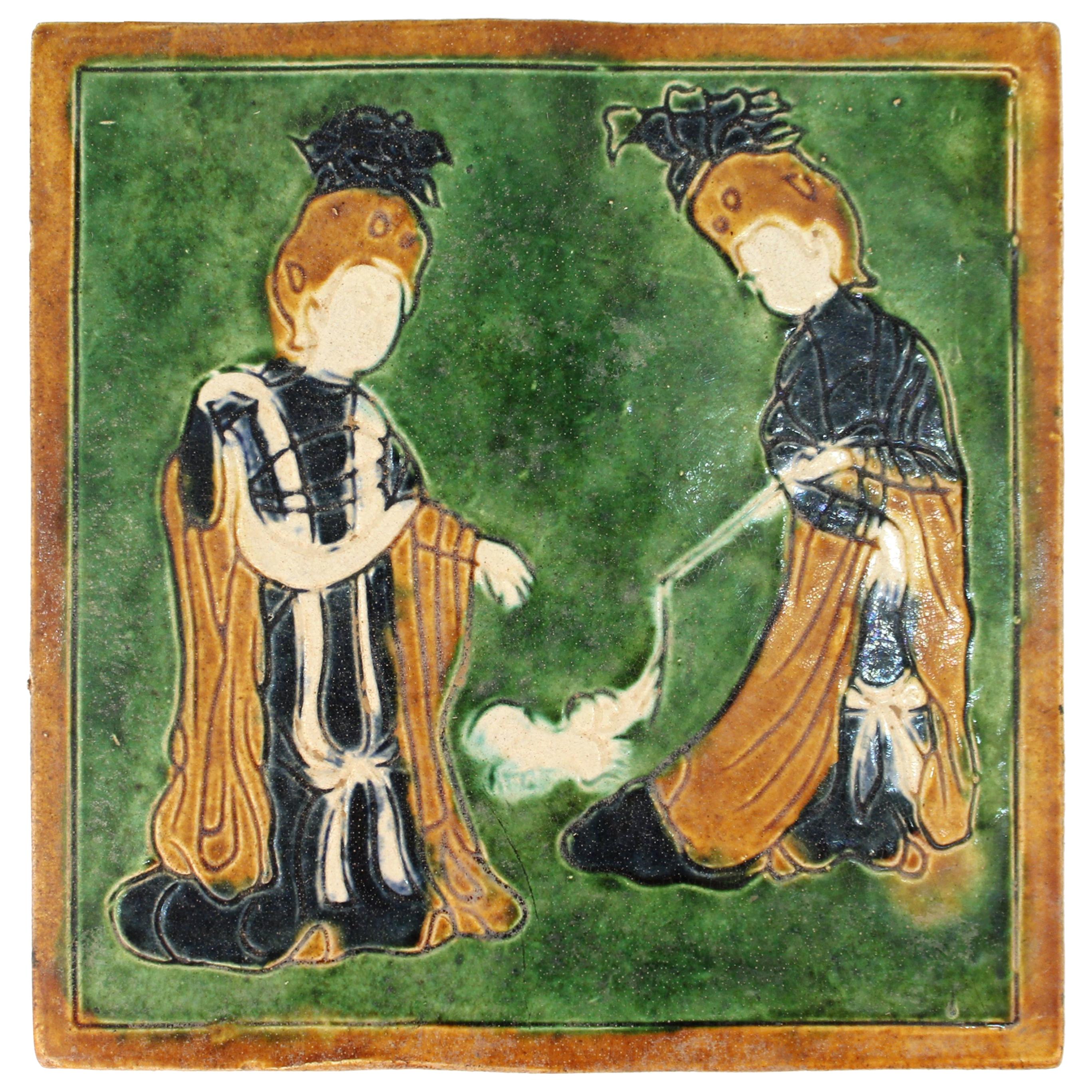 Chinese Tang Style Sancai-Glazed Flat Tile Depicting Women Playing with a Dog