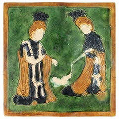 Chinese Tang Style Sancai-Glazed Flat Tile Depicting Women Playing with a Dog