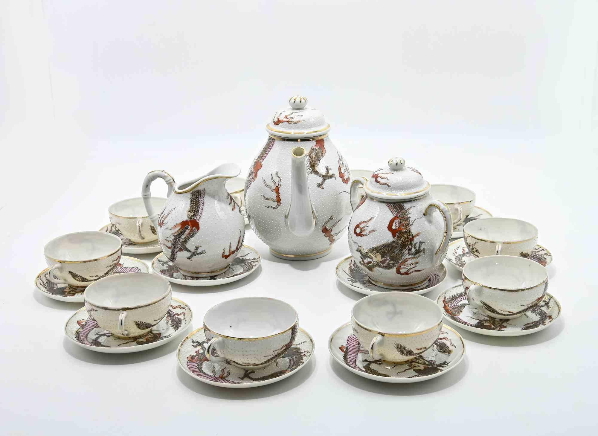 Chinese set is a 13-piece tea service, 1950s.

Hand-painted porcelain with oriental decorations.

Dimensions:  Cup D 7.5 x H 4 cm. Teapot: D 10 x H 15 cm. Saucer D 10 cm.

Very good condition!  