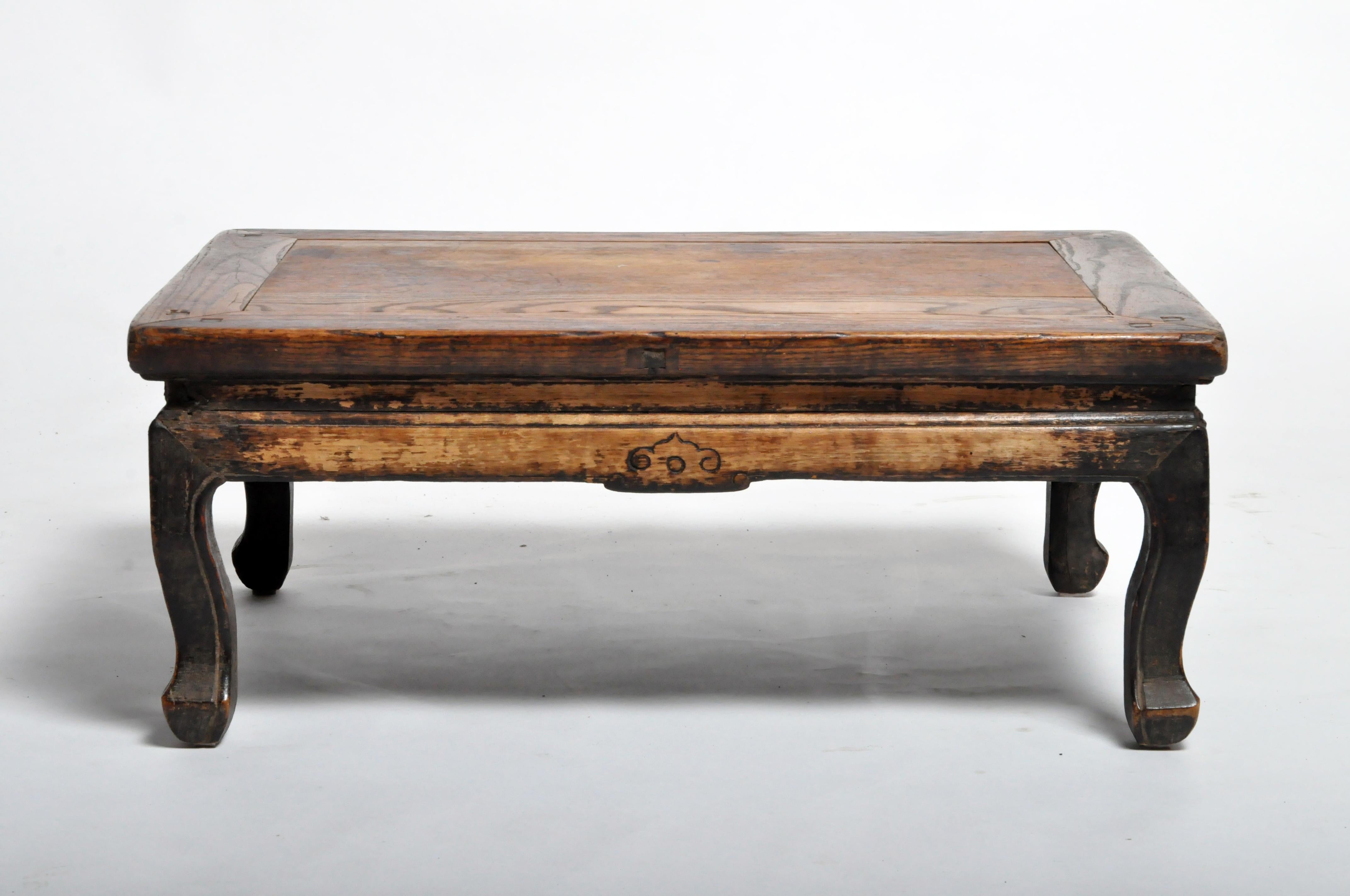 This Chinese tea table is from Beijing, China, and was made from elmwood, circa 1900. The piece features its original beautifully aged patina. Wear consistent with age and use.
 