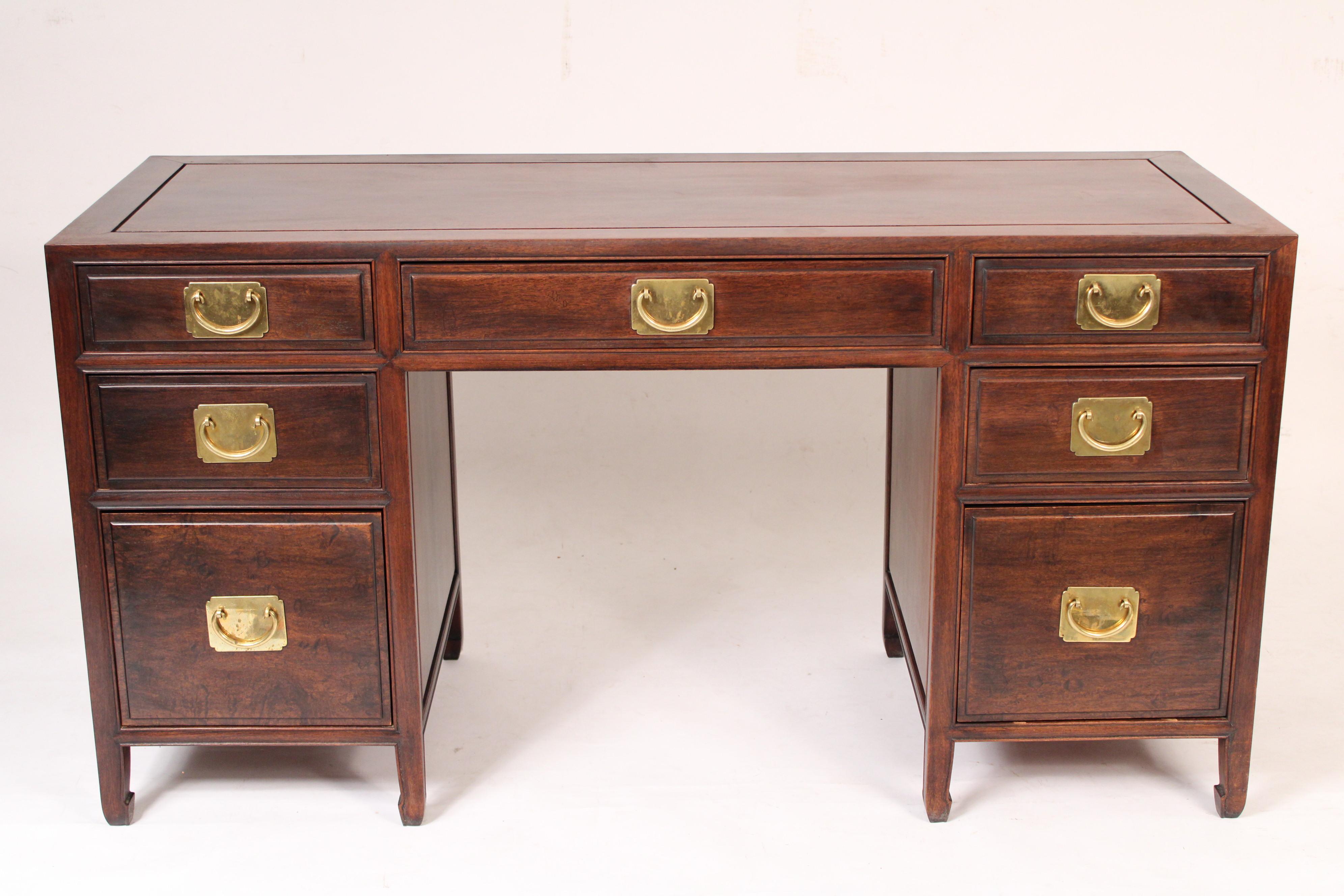 Chinese teak wood double pedestal desk, circa 1960's. With a rectangular top, 3 frieze drawers over two pedestals, left pedestal with two drawers the bottom drawers interior measurement is, height 11