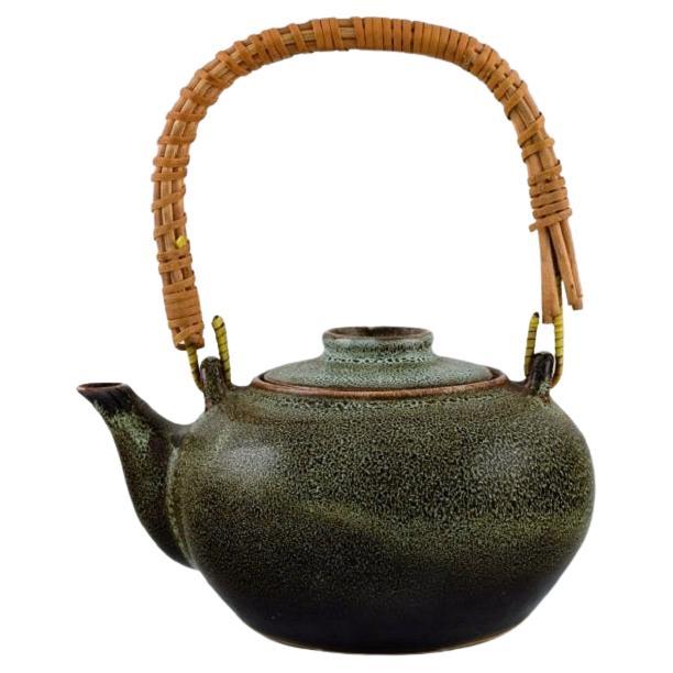 Chinese Teapot in Glazed Stoneware with Wicker Handle, 20th C For Sale