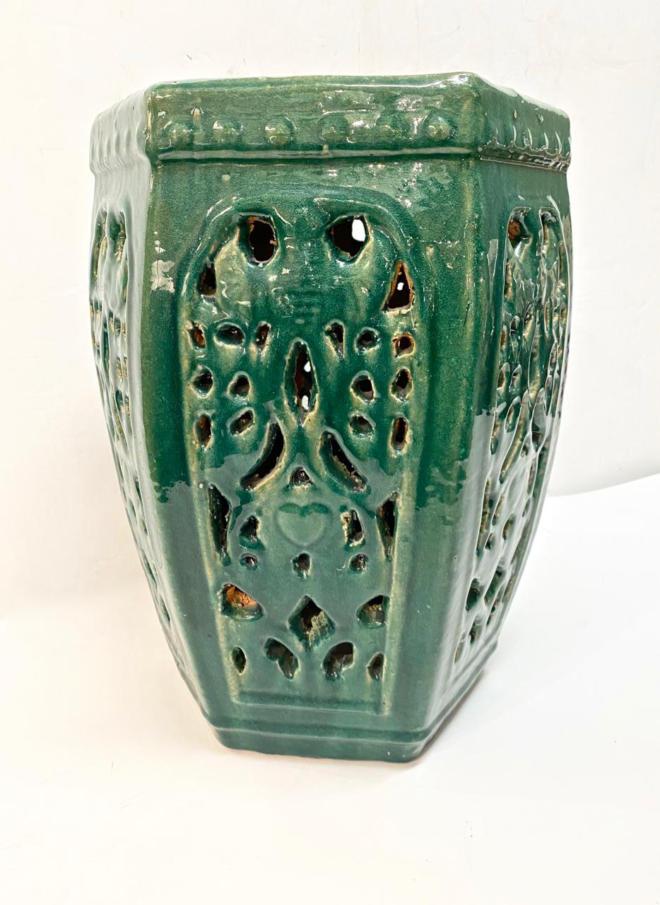 This is an example of a Chinese 6-sided reticulated green glazed garden seat. This seat most probably dates to the late 20th century. The deep green would add life to any design theme. The seat is in overall very good condition.