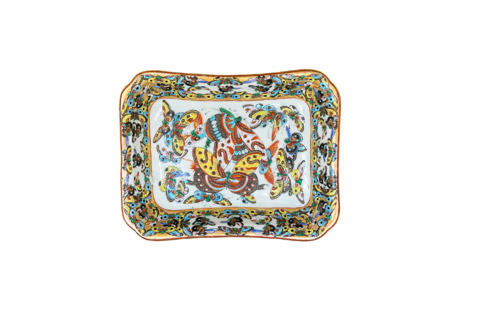 Chinese thousand butterfly dish, is decorated with multicolored butterflies. The border has a gilt background.
   