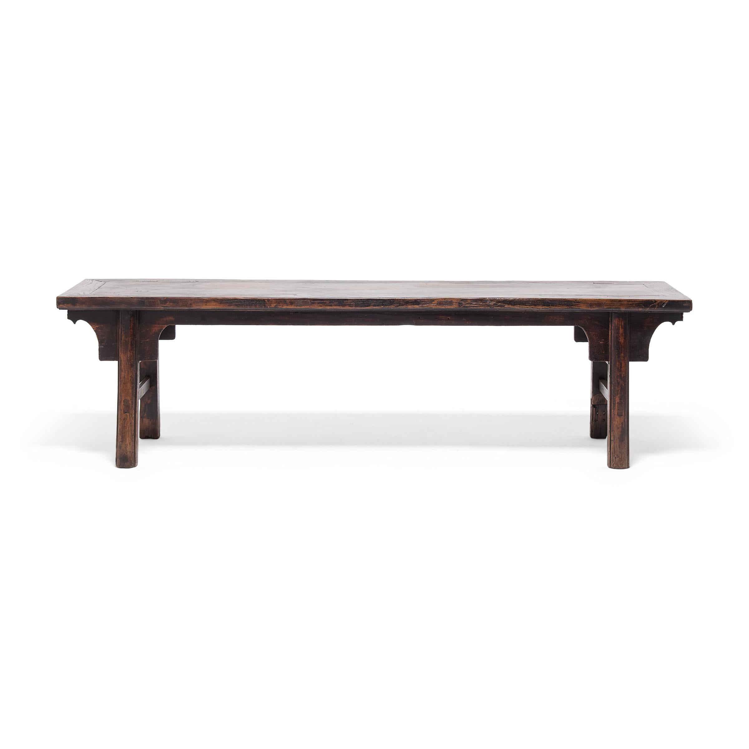 This three-person bench from China's Shanxi province follows the classic recessed-leg form, defined by legs that are set back from the edge of the top surface and slightly splayed for stability. Popular since the Song dynasty, the recessed-leg