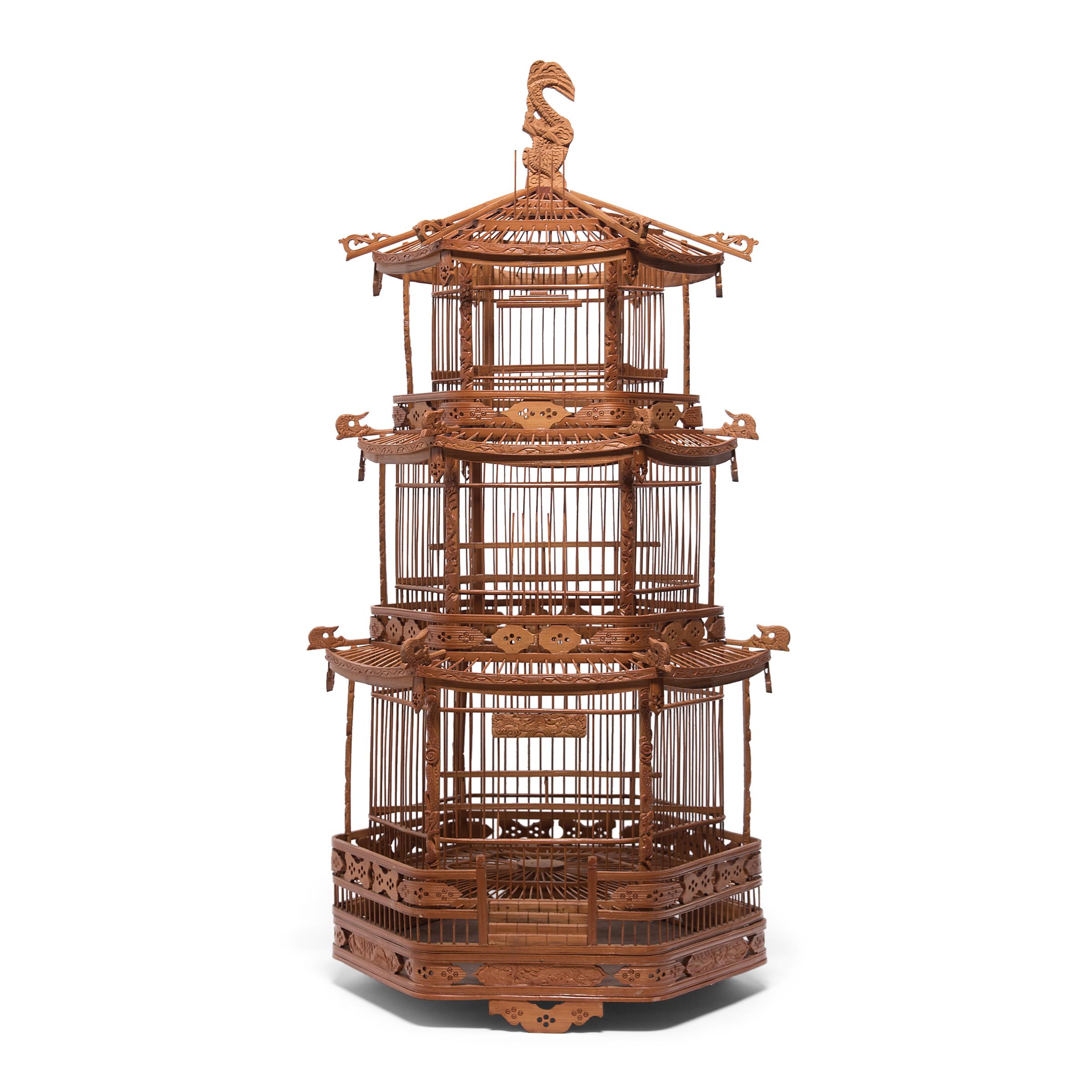 A triumphant display of grandeur and fine craftsmanship, this monumental birdcage was once home to the pet bird of a Qing-dynasty aristocrat. Dated to the late 19th century, the cage was carefully assembled into the shape of a towering three-tiered