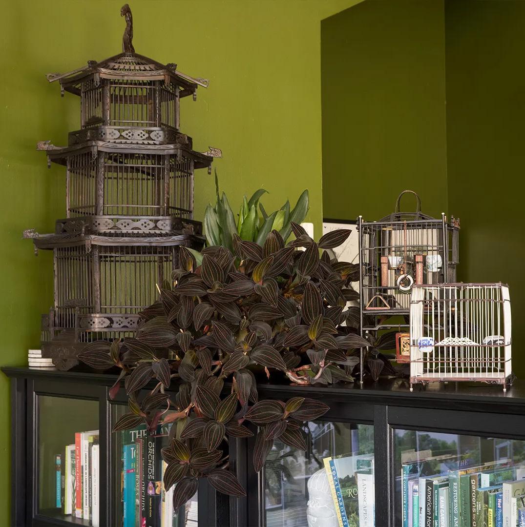 A triumphant display of grandeur and craftsmanship, this monumental birdcage was once home to the pet bird of a Qing-dynasty aristocrat. Dated to the early 20th century, the cage was carefully assembled of thin bamboo rods into the shape of a