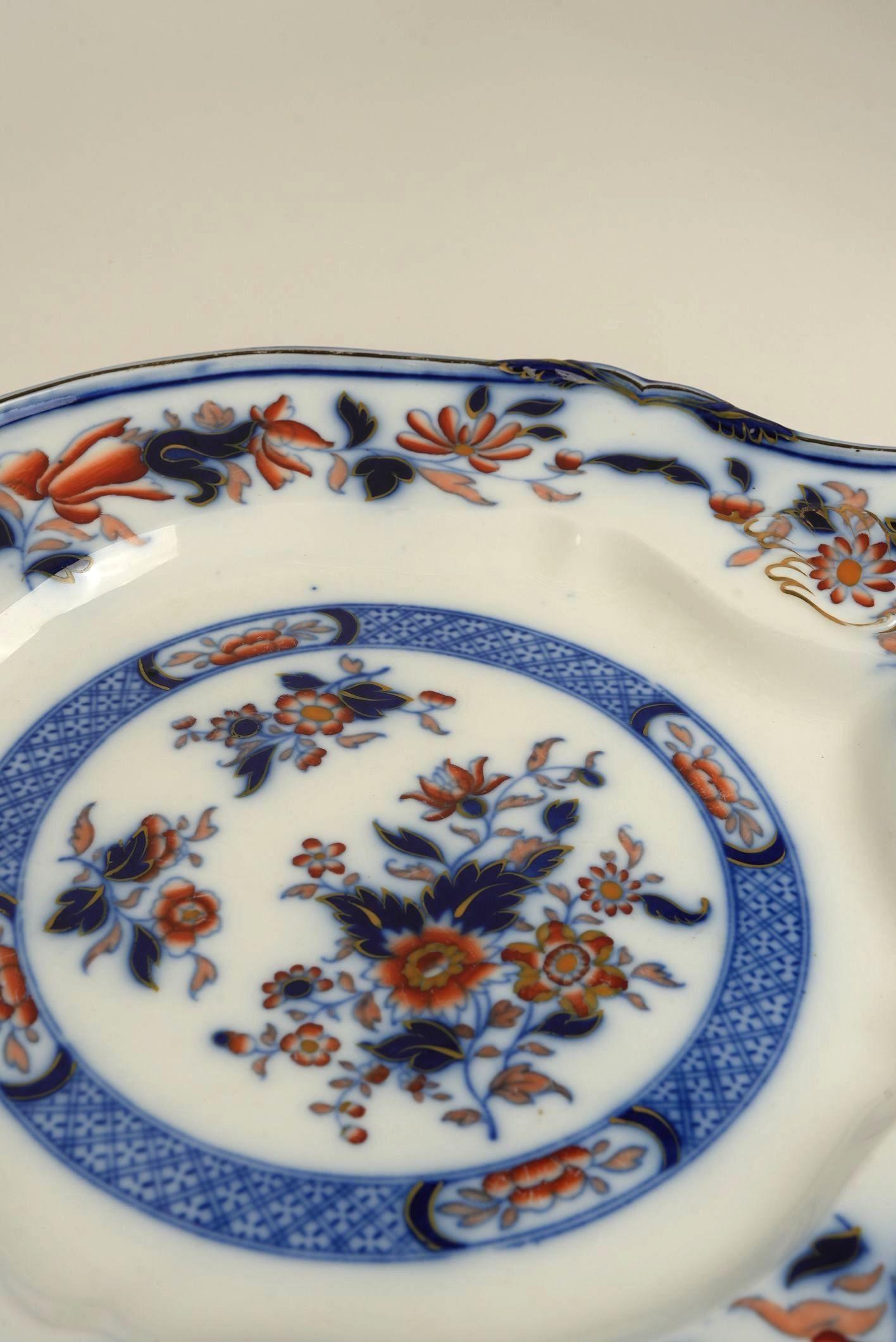 Crafted by Thomas Dimmock & Co., a respected name in 19th-century English earthenware, this platter features the much-celebrated Chinese Tree pattern — a bold and romantic interpretation of Eastern botanical motifs, tailored for the Western market.