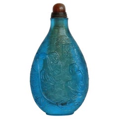 Retro Chinese Turquoise Glass Snuff Bottle with Carved Figures and Spoon Top