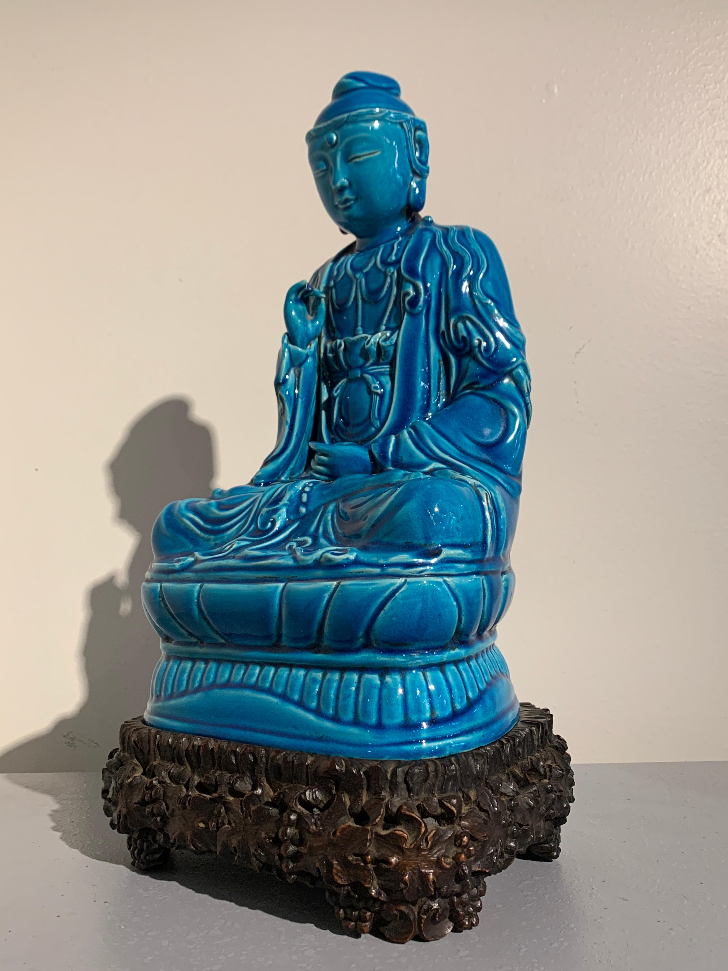 A gorgeous Chinese turquoise glazed porcelain figure of the Guanyin, the Bodhisattva of Compassion and Mercy, very late Qing Dynasty, circa 1910, China. 

This beautiful sculpture of Guanyin is crafted in porcelain and glazed all-over in a deep,