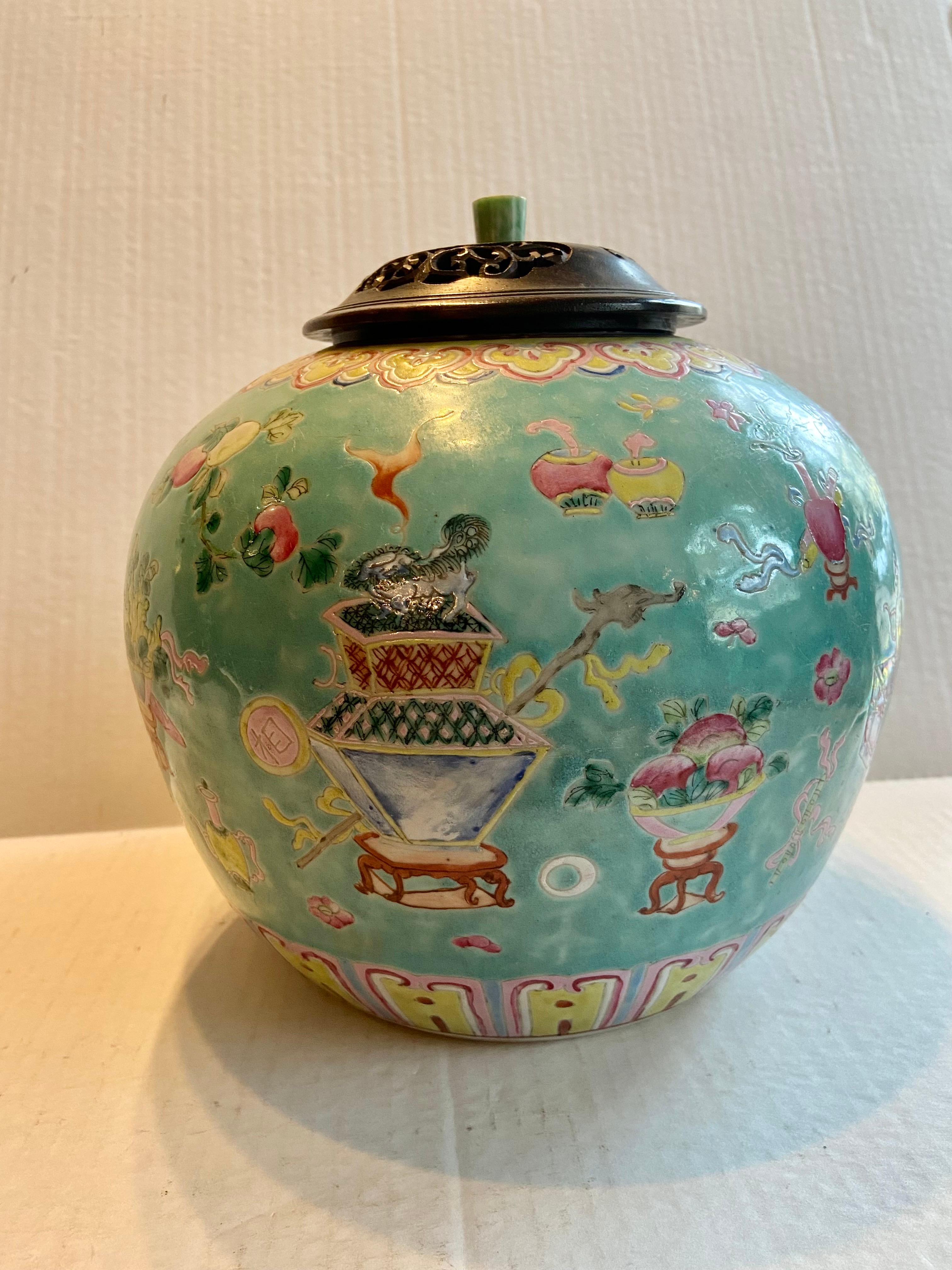 Chinese hand painted Late Qing Dynasty (late 19th century) Turquoise Ground Famille Rose porcelain lidded ginger jar. The jar is finely decorated in rich polychrome enamels with soft colored symbols of a joyful life, these were typical motifs on